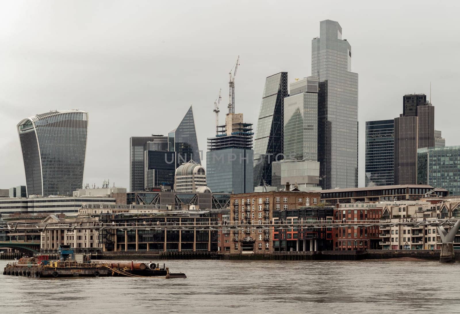 London, UK - Dec 25, 2023 - View of skyscrapers in the business district of London and River thames. Architectural modern buildings of the city, Space for text, Selective Focus.