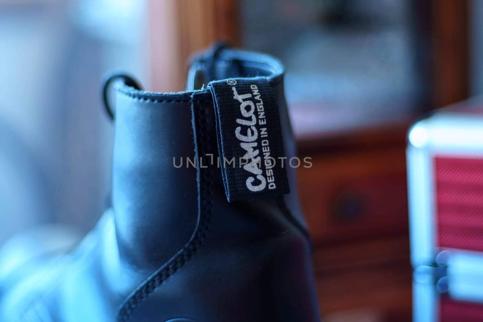 Tyumen, Russia-January 11, 2024: Black shoe featuring a Camelot brand name tag attached to it, showcasing the unique branding of the footwear.