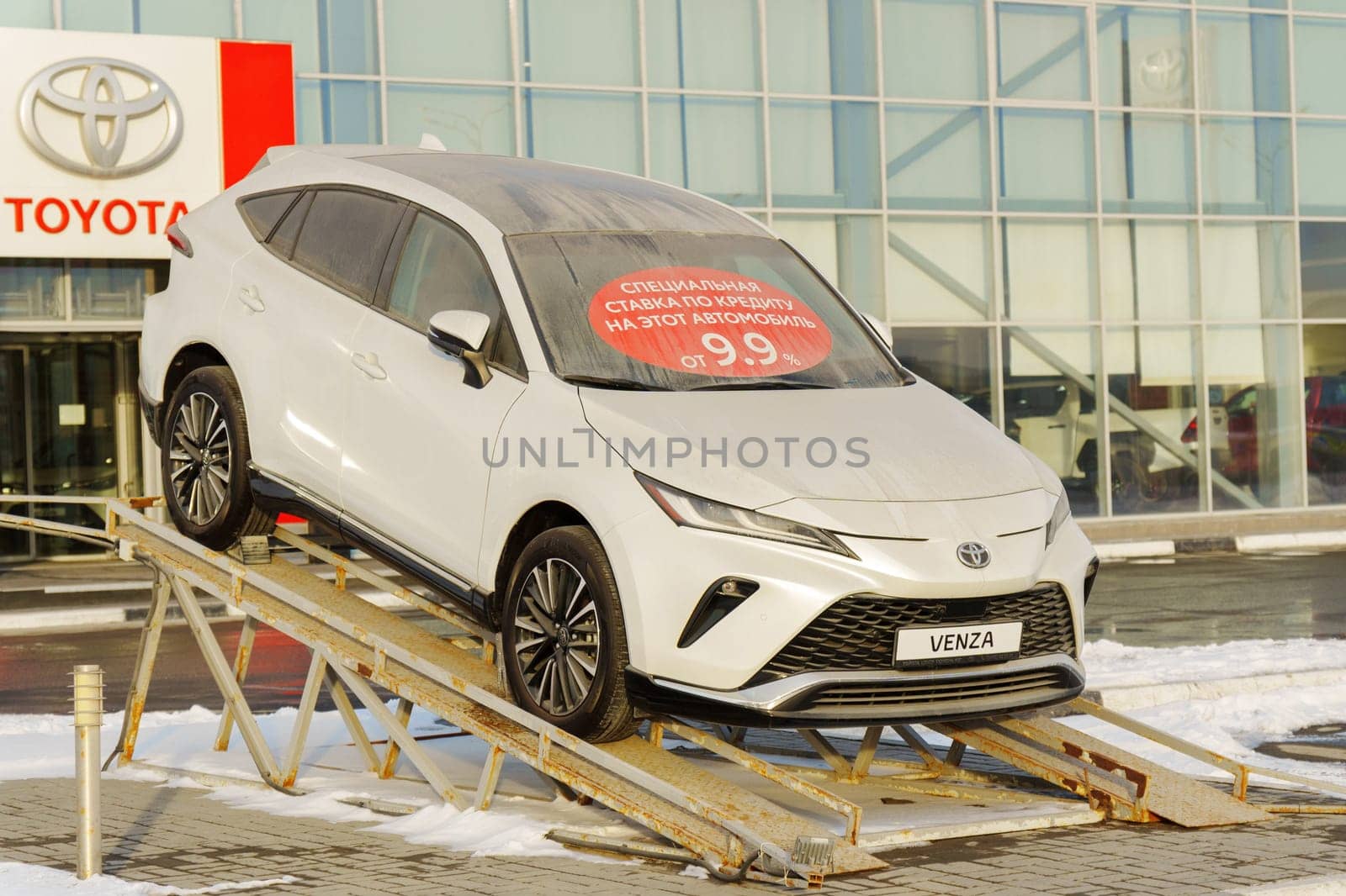 Tyumen, Russia-March 02, 2024: Toyota Venza is showcased on an inclined ramp outside a showroom.