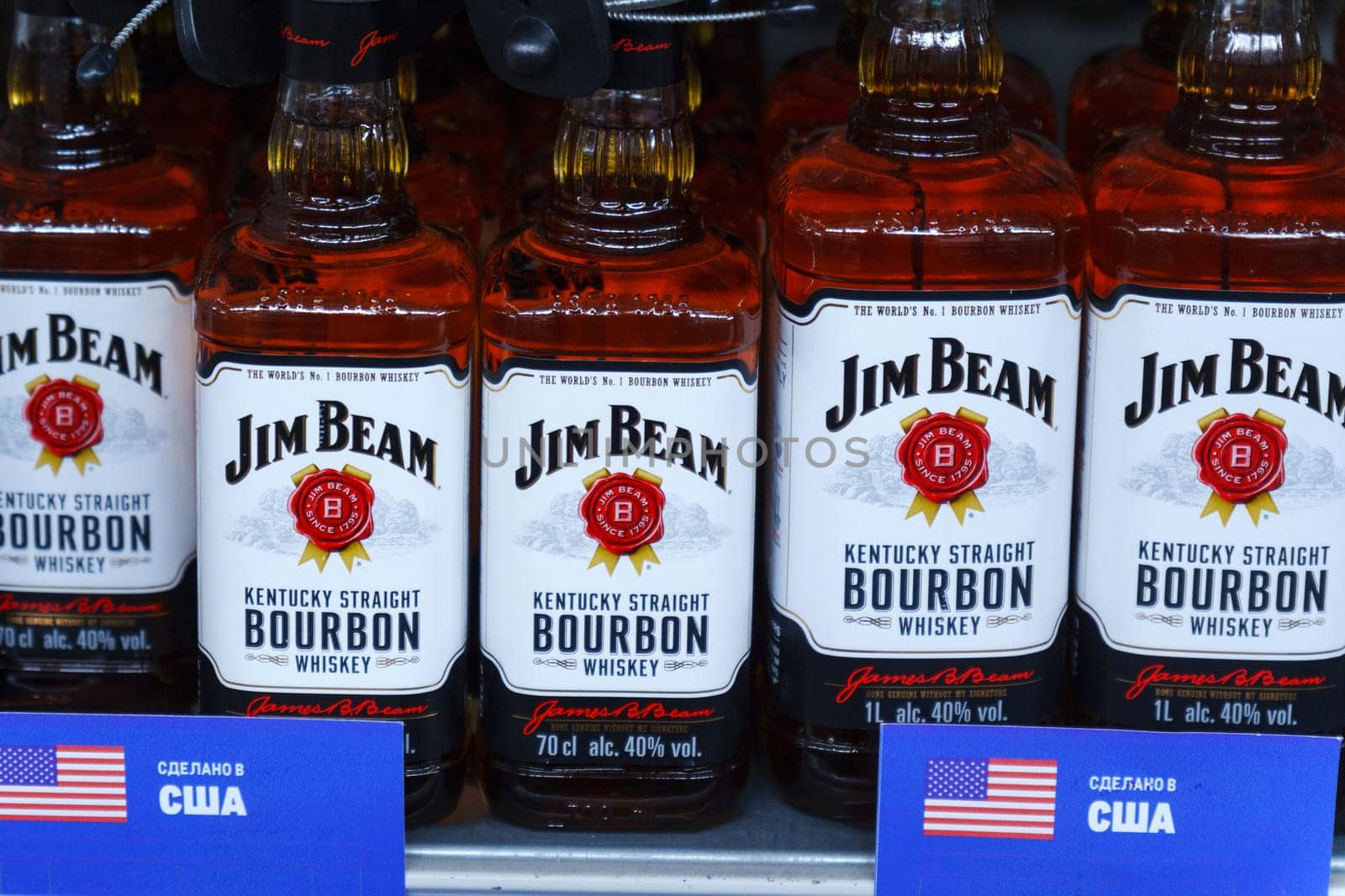 Tyumen, Russia-March 02, 2024: Assorted Bourbon Jim Beam Bottles Displayed on Shelf by darksoul72