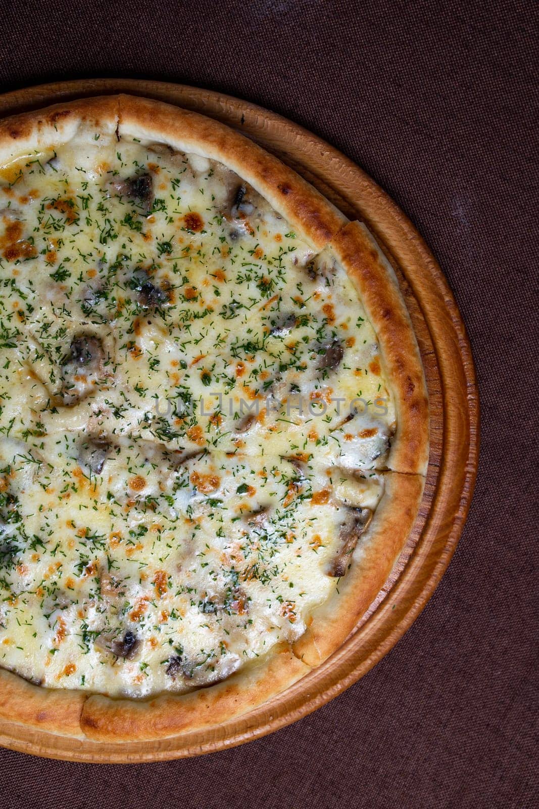 Delicious pizza with a crispy crust, topped with gooey melted cheese, flavorful mushrooms, and fragrant herbs for a satisfying meal.