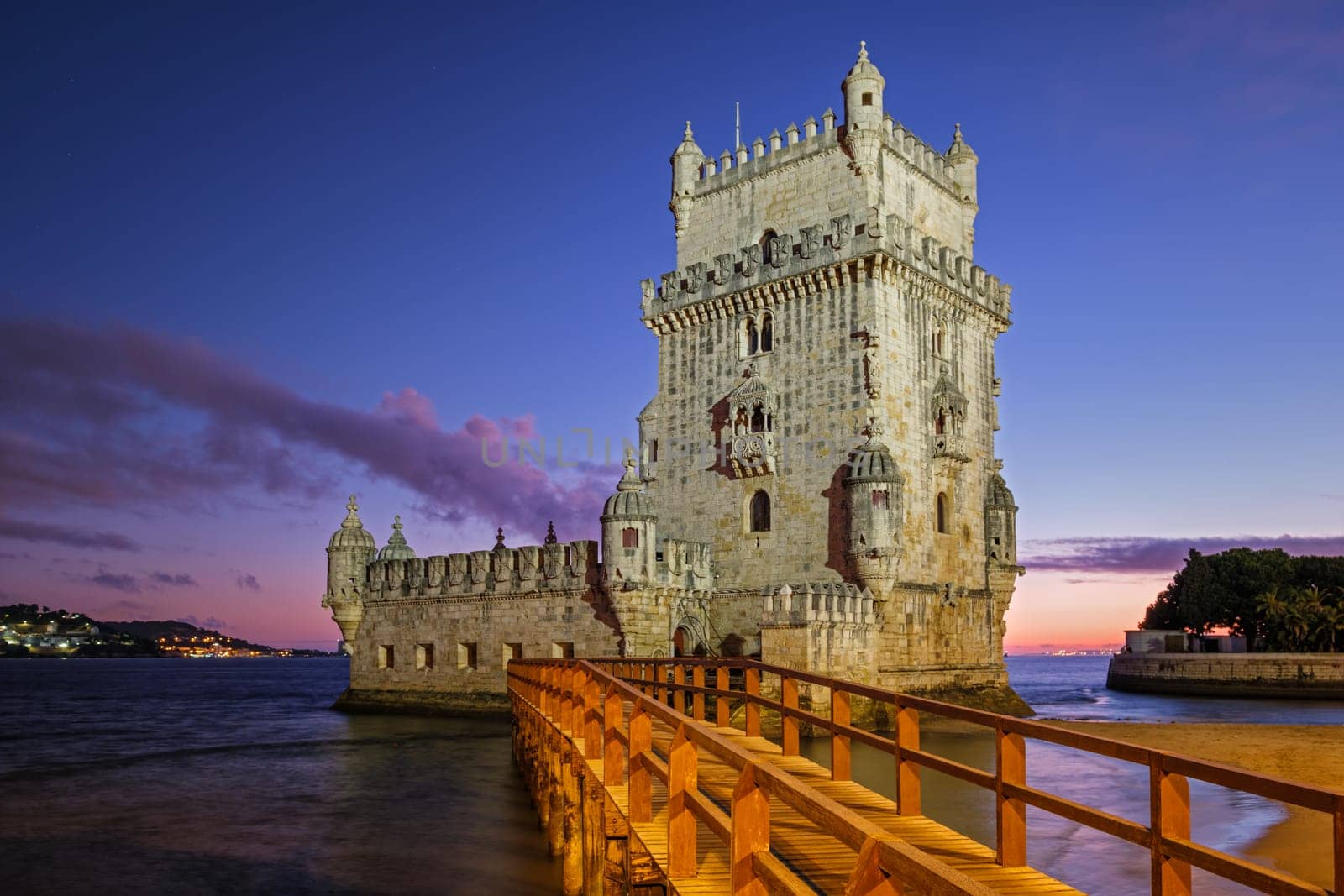 Belem Tower on bank of Tagus River in twilight. Lisbon, Portugal by dimol