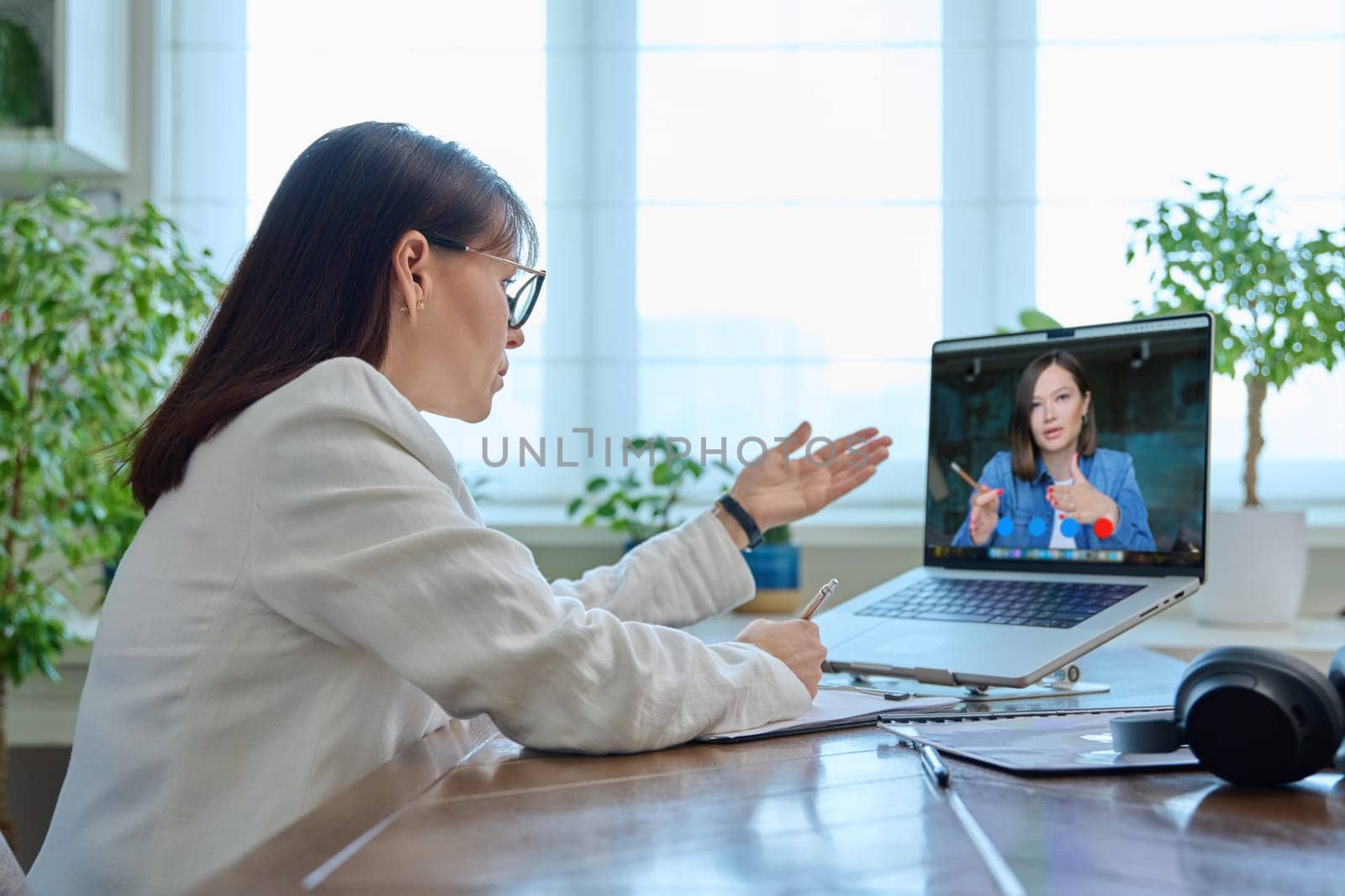 Online work video meeting of two female colleagues by VH-studio