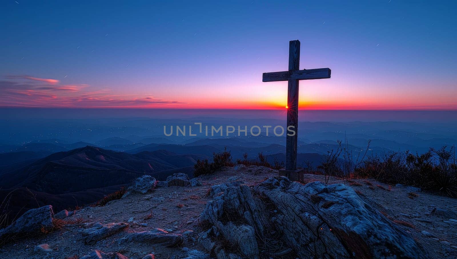 cross on the top of the mountain at sunrise with a beautiful sky by ailike
