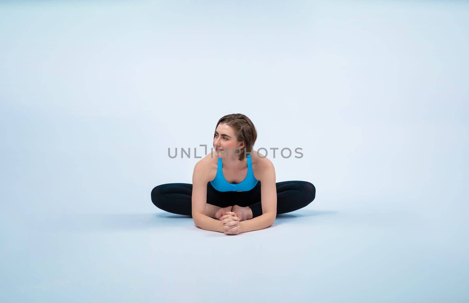 Full body length gaiety shot athletic and sporty woman doing healthy and meditative yoga exercise workout posture on isolated background. Healthy active and body care lifestyle