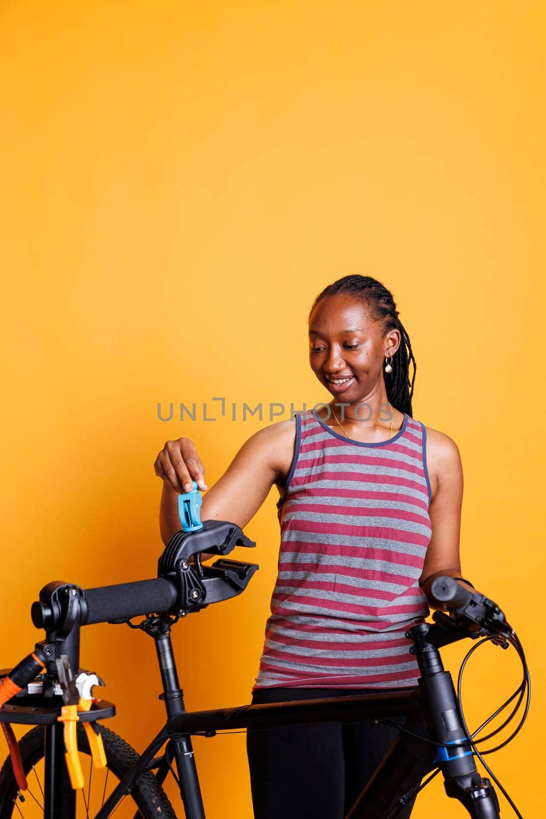 African American Female Cyclist at Work by DCStudio