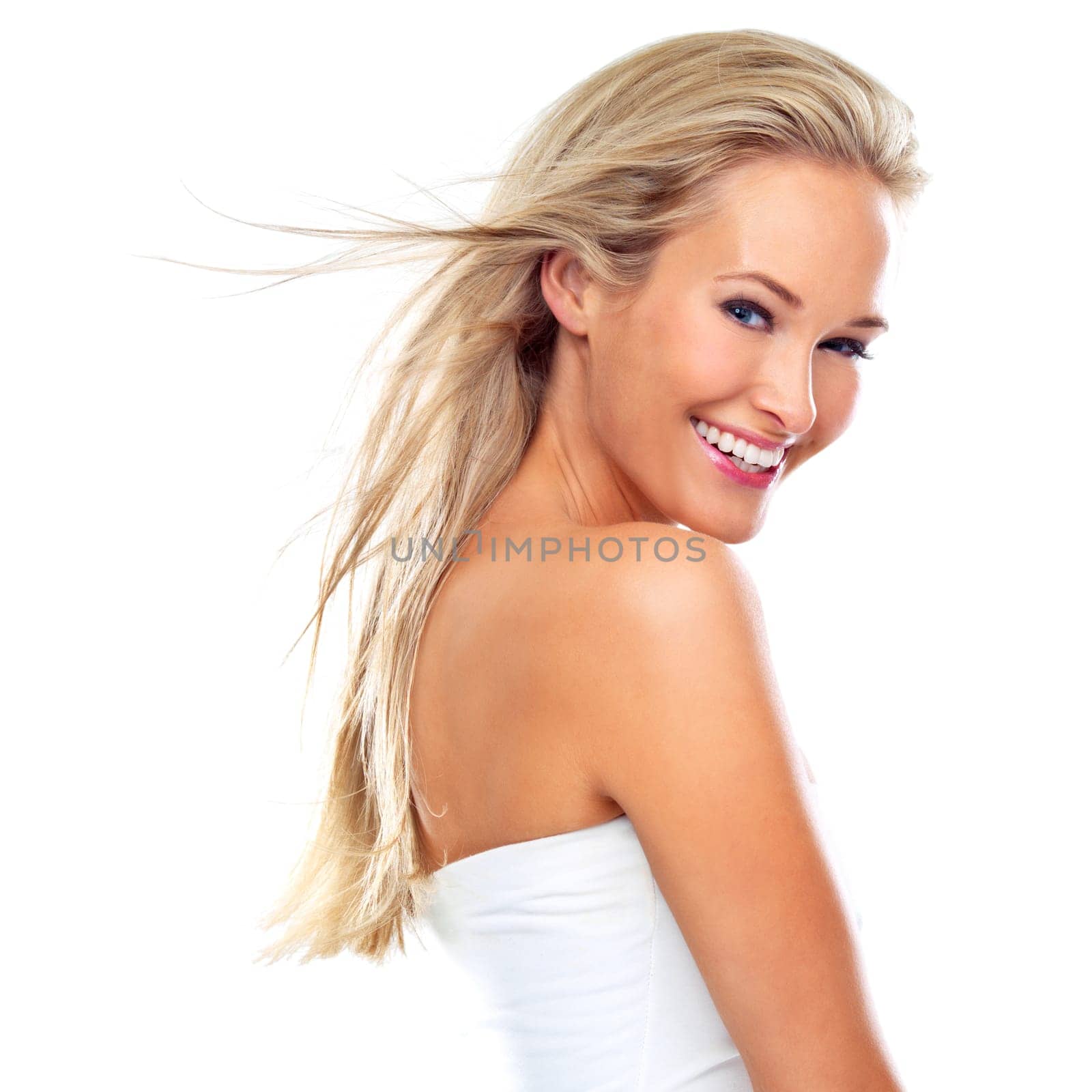 Portrait, hair care and happy woman in wind for beauty, skincare or body health isolated on a white studio background. Face, smile and hairstyle of blonde person in salon with makeup or cosmetics.