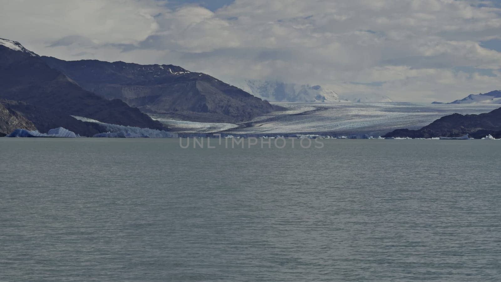 Boat tour on Lago Argentino showcasing the majestic Upsala Glacier, an emblem of nature's splendor and environmental shifts.
