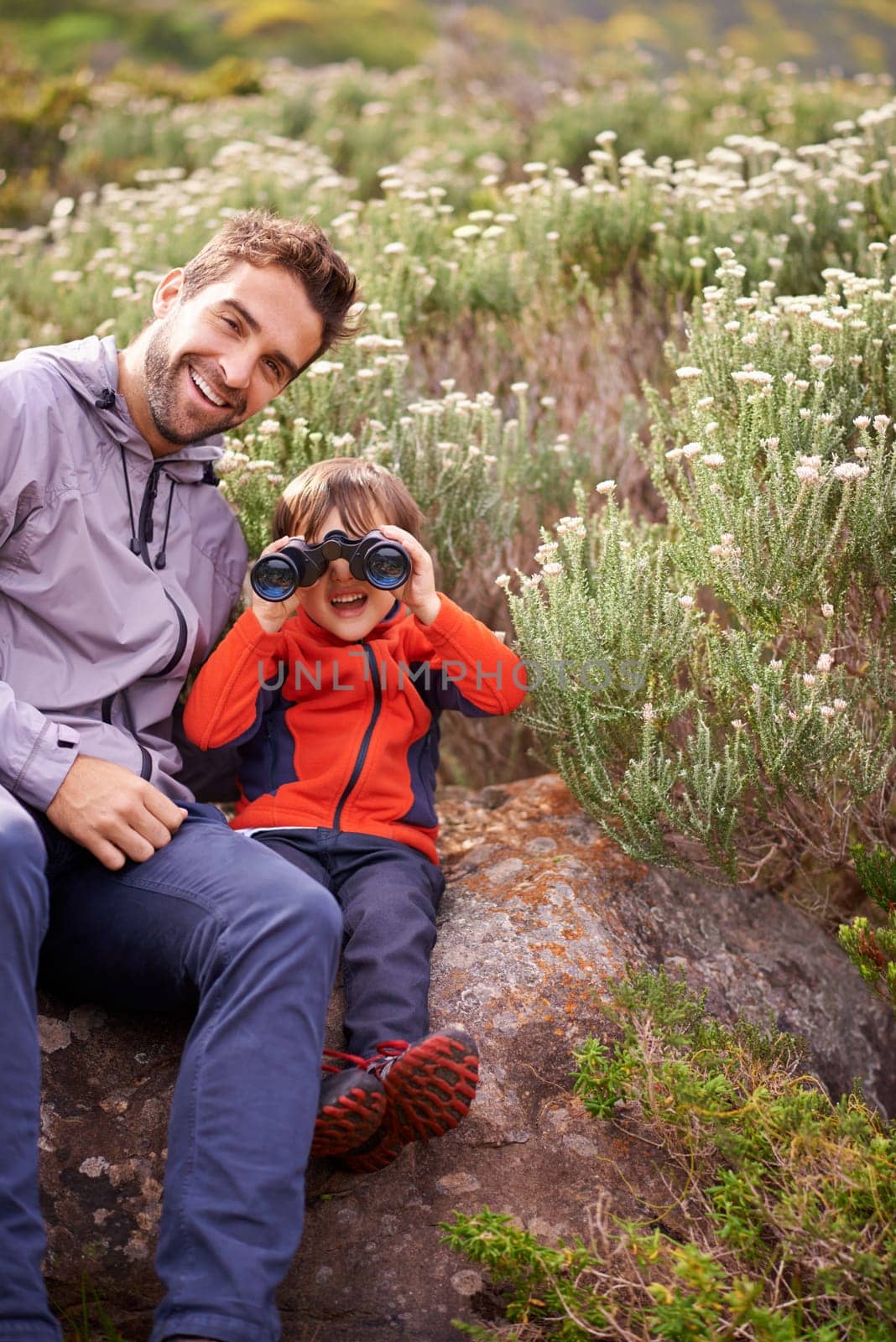 Dad, child and binoculars with smile from hiking, travel and watching in nature with adventure. Parent, youth and father with love, support and trust outdoor with fun and view on trip with walking by YuriArcurs