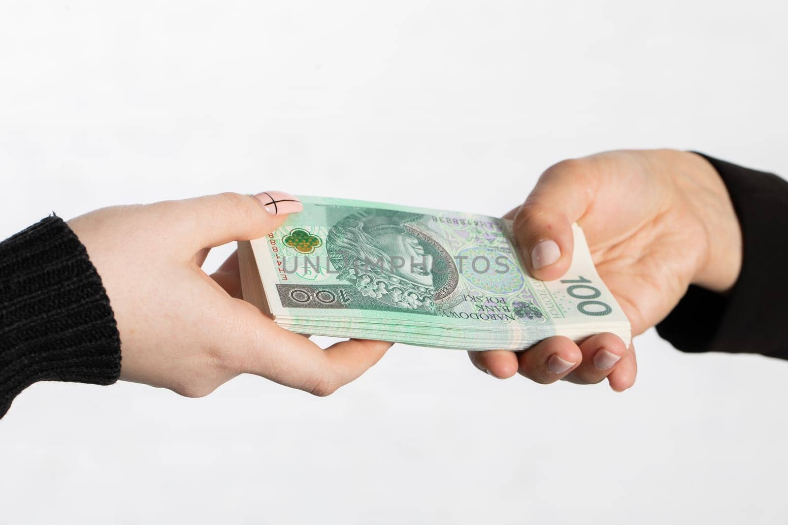 On the zoom you can see female hands full of banknotes as they exchange cash.