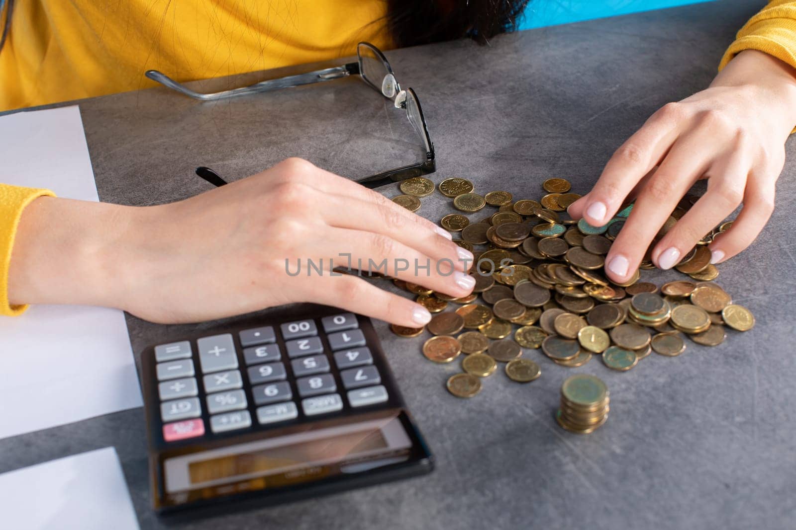 Accurate counting of every penny using a calculator while expenses are increasing.