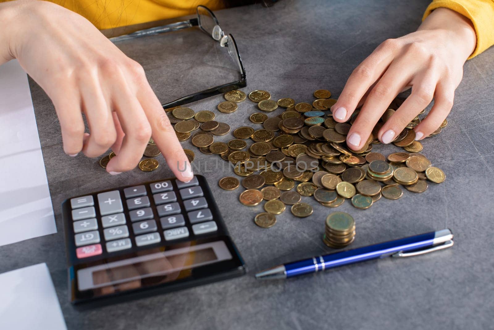 Accurate counting of every penny using a calculator while expenses are increasing.
