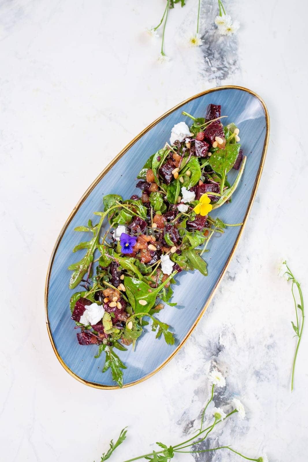 Wholesome and colorful salad of organic baby greens, roasted beets, creamy goat cheese, crunchy pistachios, and a light citrus dressing.