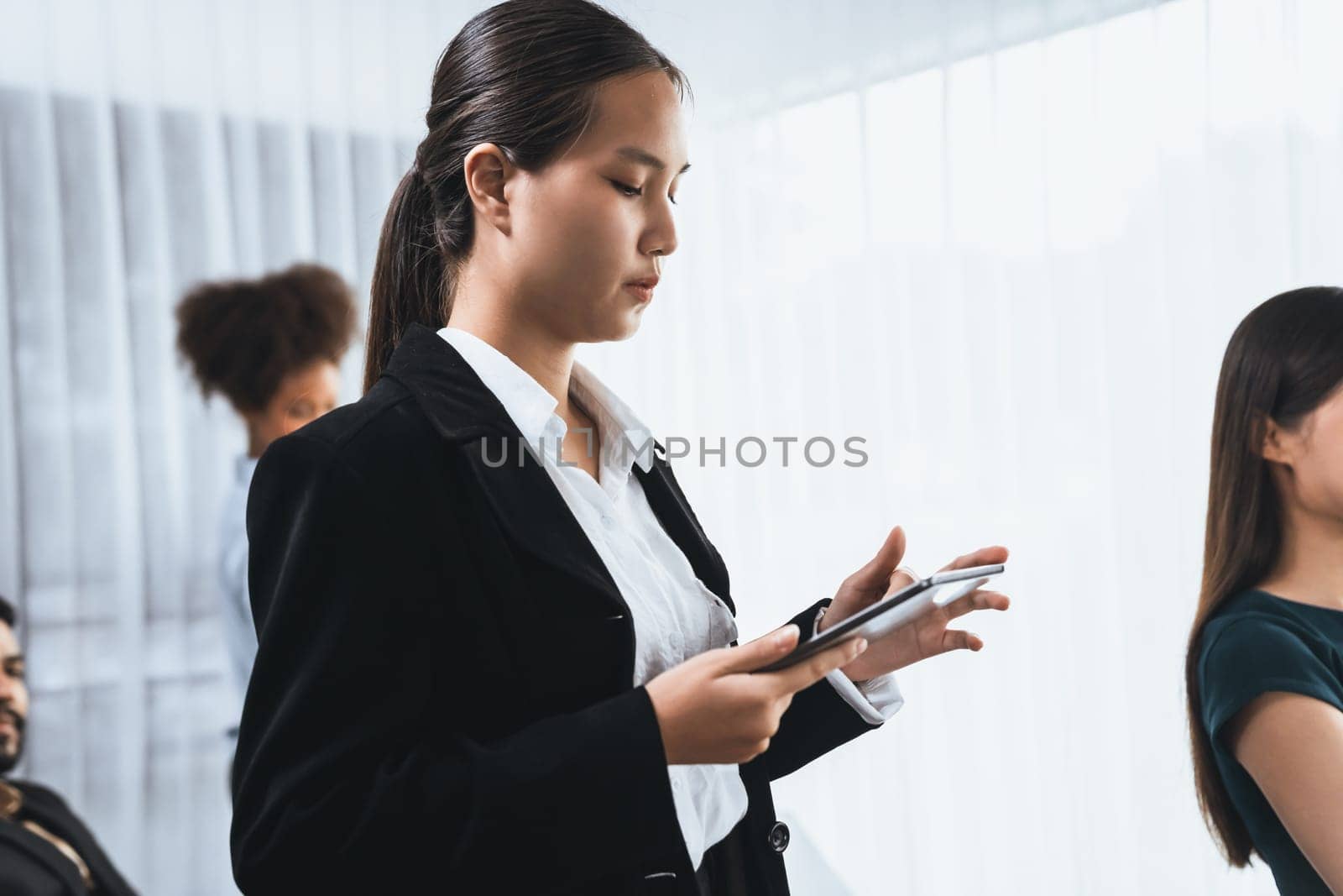 Happy diverse business people work together, discussing in corporate office. Professional and diversity teamwork discuss business plan on desk with laptop. Modern multicultural office worker. Concord