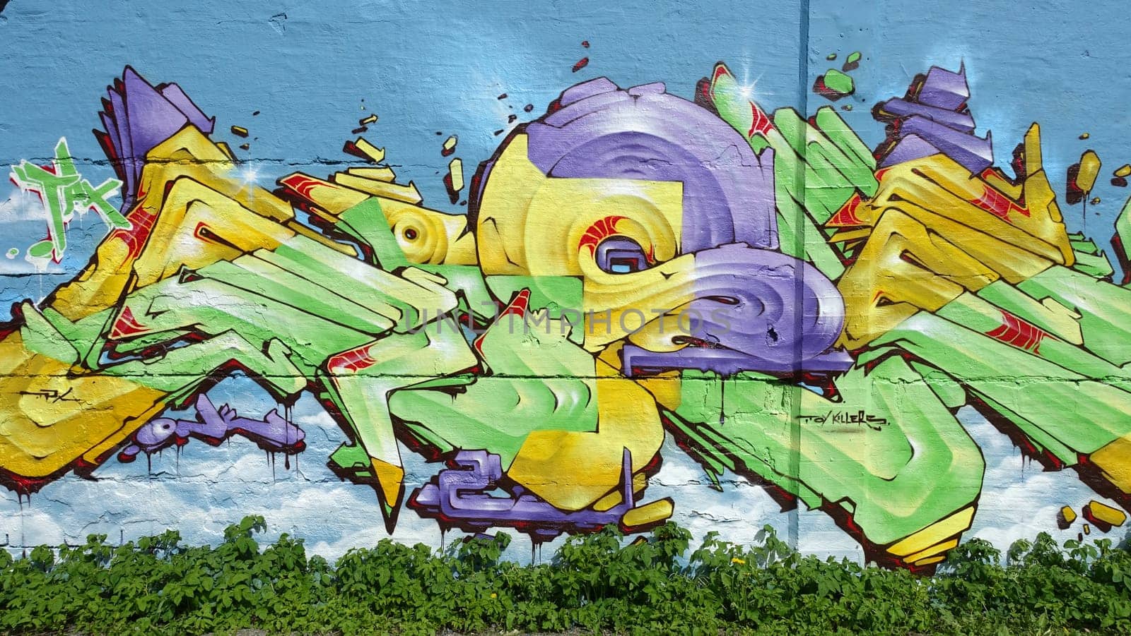 Stockholm, Snosatra, Sweden, May 23 2021. Graffiti exhibition on the outskirts of the city. Yellow.