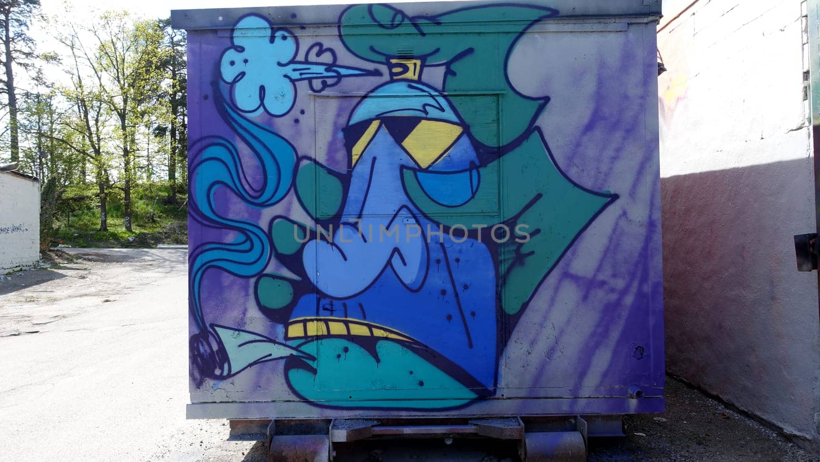 Stockholm, Snosatra, Sweden, May 23 2021. Graffiti exhibition on the outskirts of the city. Smoking.