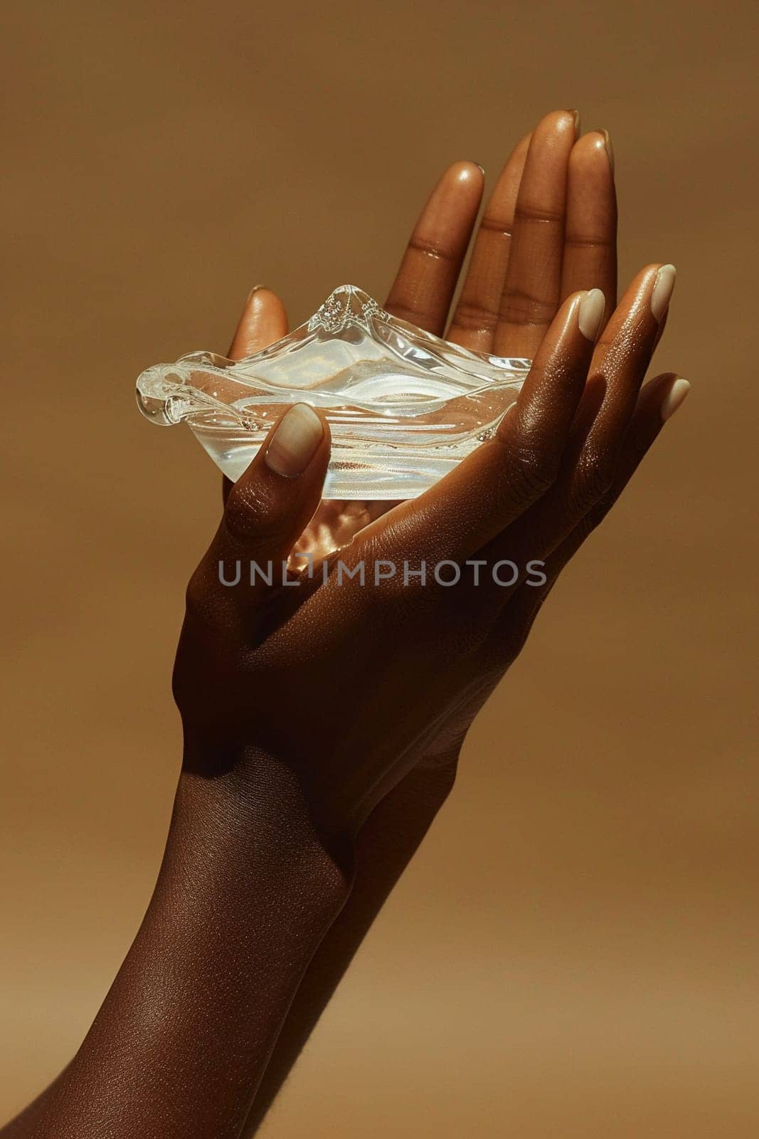 Close-up of hand applying moisturizer, representing skincare and hydration.