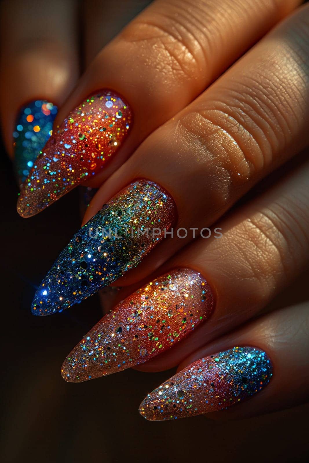 Close-up of hand with glittery nail art, showcasing creative beauty and fashion.