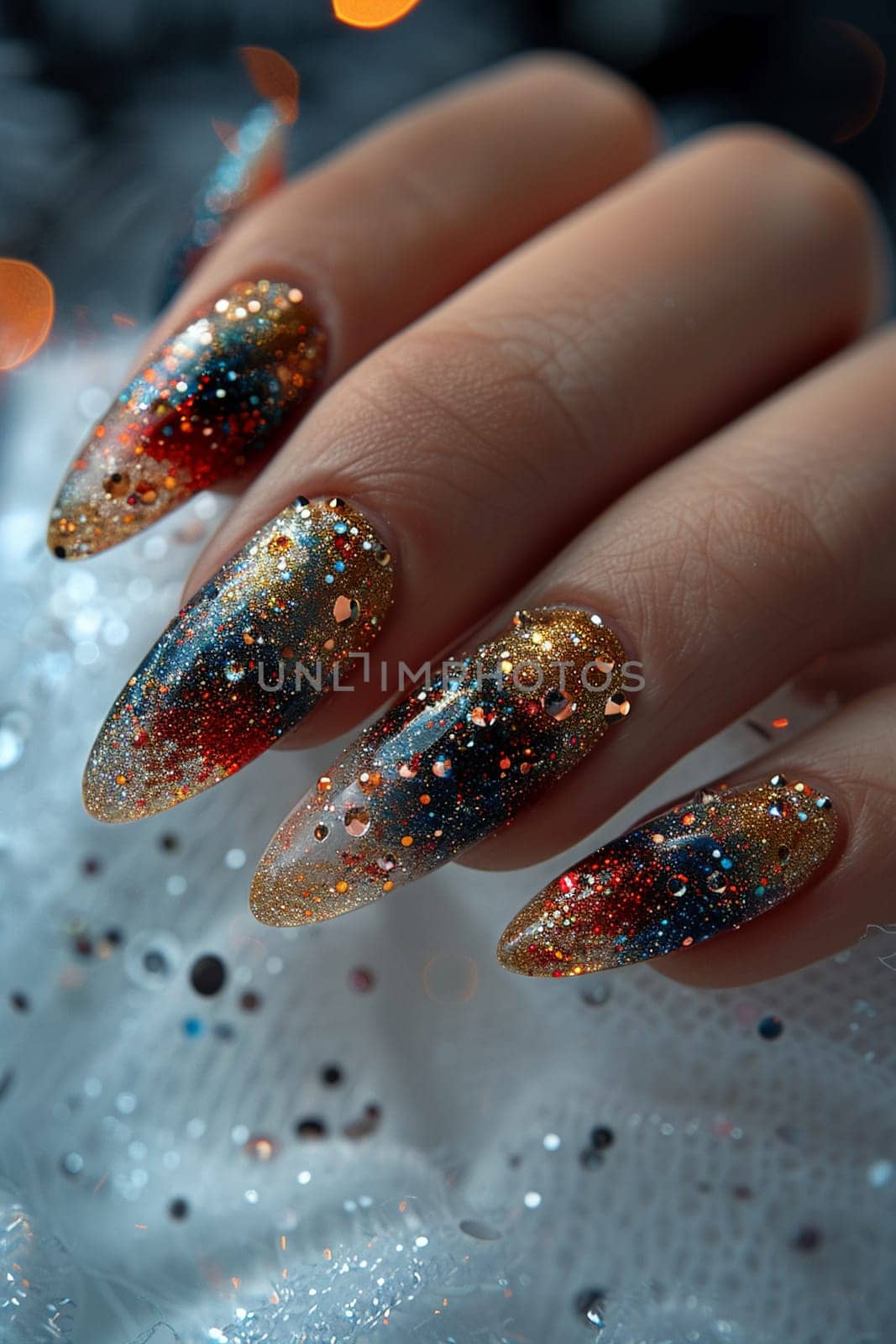 Close-up of hand with glittery nail art, showcasing creative beauty and fashion.