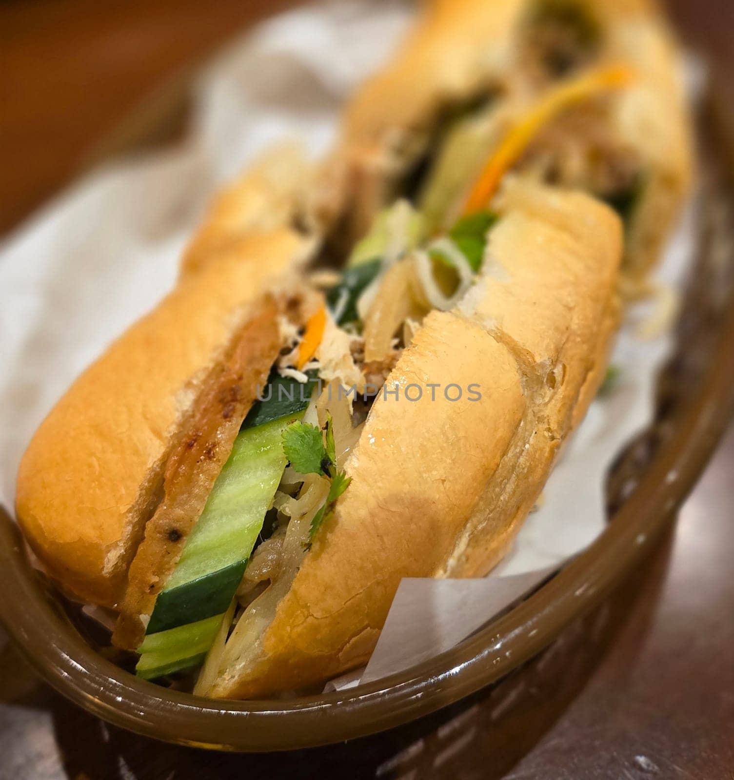 Sandwich Banh mi, vietnamese baguette with grilled chicken and mixed salad, vietnamese sandwich in local asian restaurant