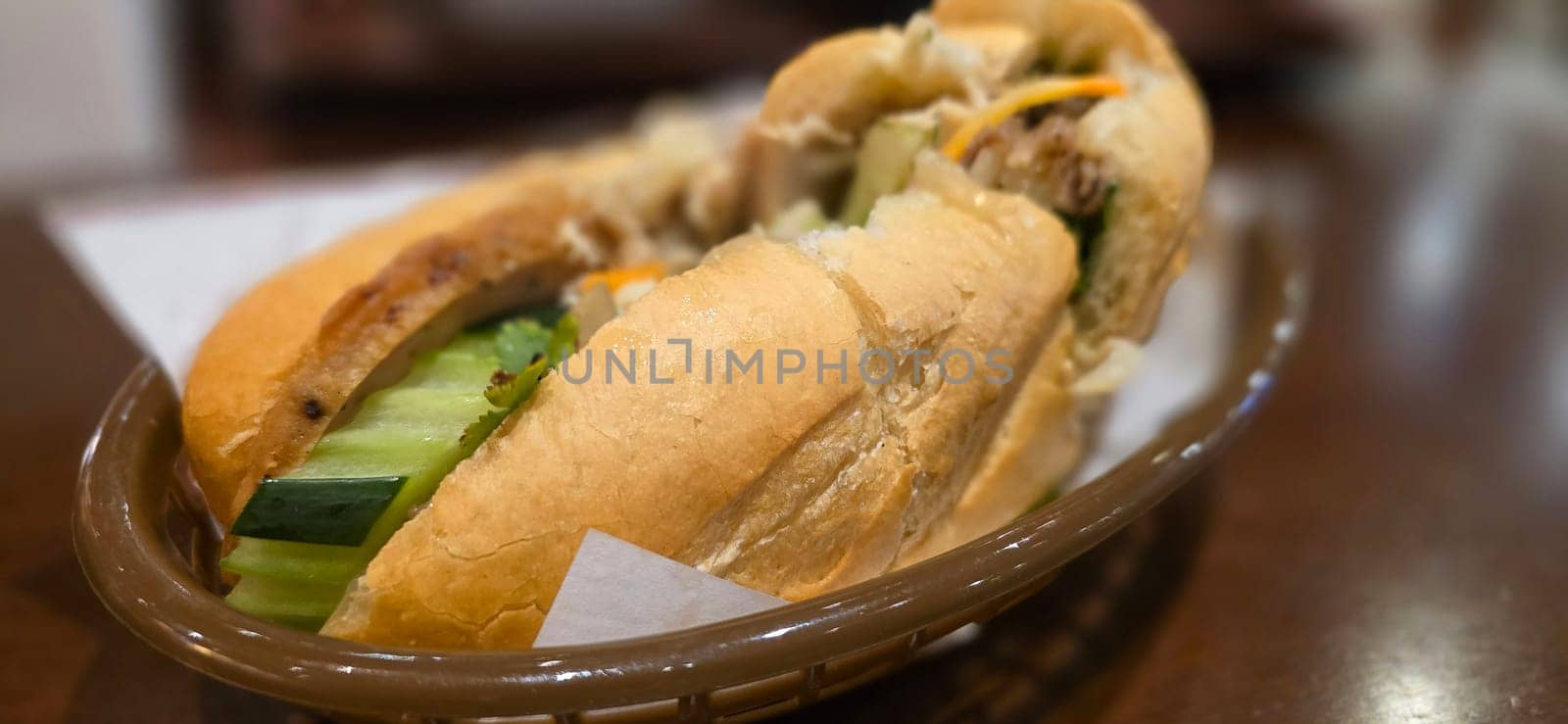 Sandwich Banh mi, vietnamese baguette with grilled chicken and mixed salad, vietnamese sandwich in local asian restaurant