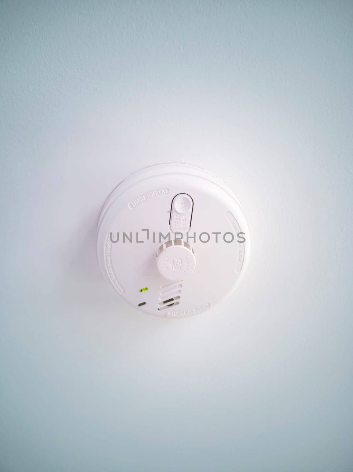 PORTNOO, IRELAND - JULY 17 2024 : Smoke detector showing green light.