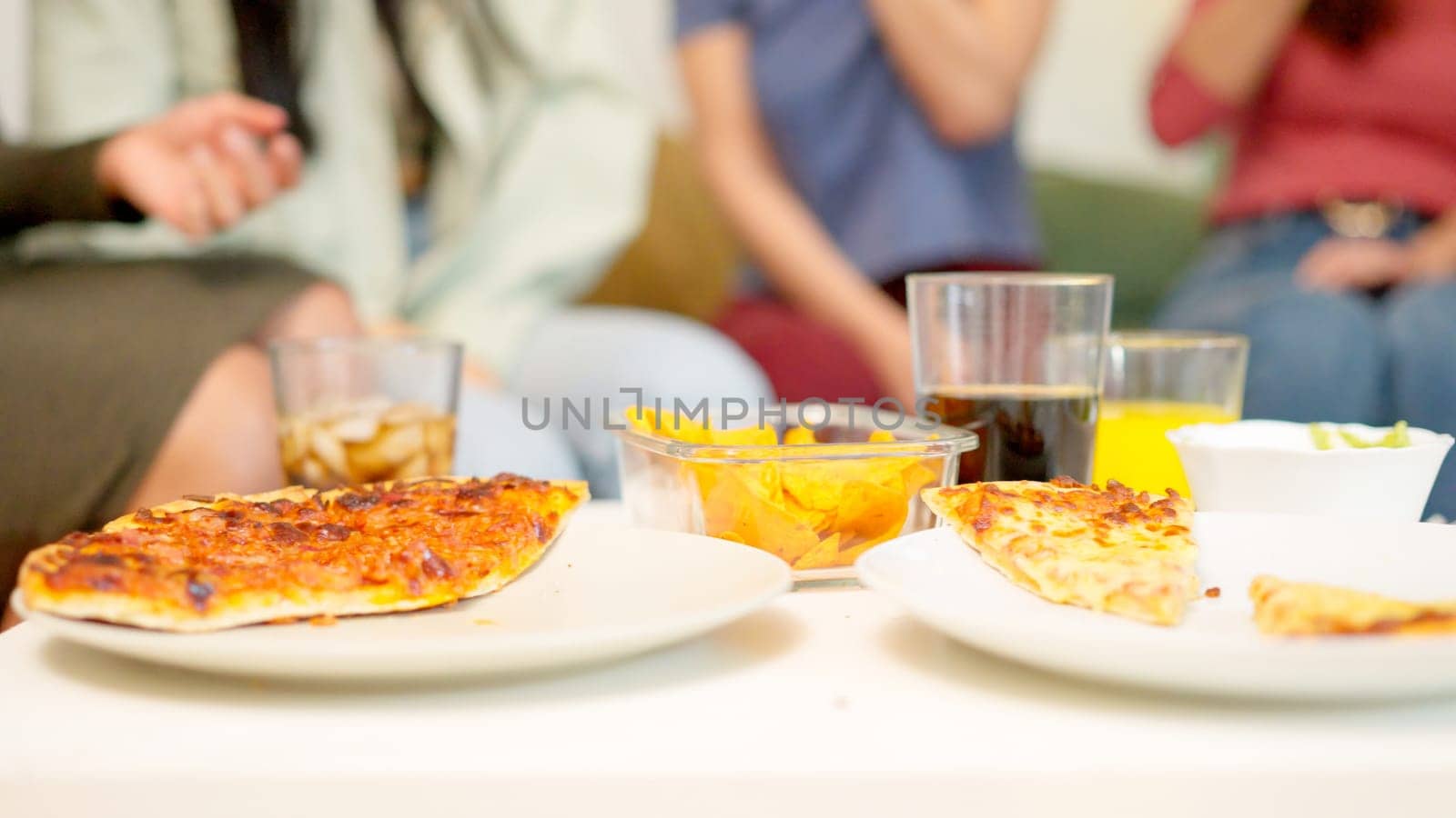 Close up of people eating delivered pizza by ivanmoreno