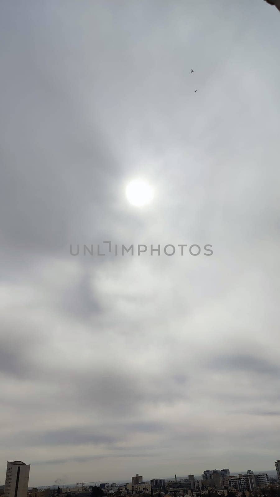 Blue gray light sky nature white clouds whether background, sun face . High quality photo