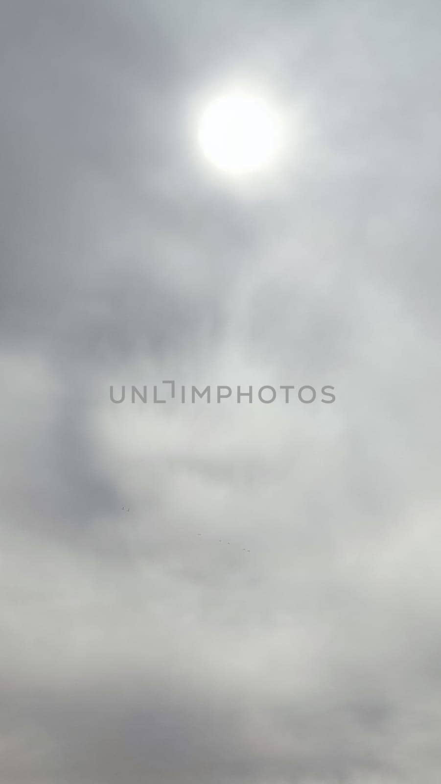 Blue gray light sky nature white clouds whether background, sun face . High quality photo
