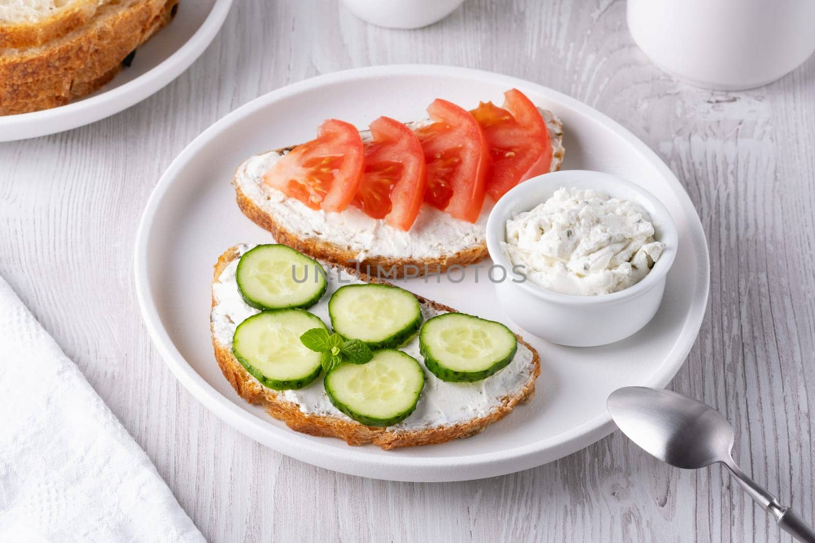 Healthy sandwiches with white cottage cheese, cucumber and tomato by NataliPopova