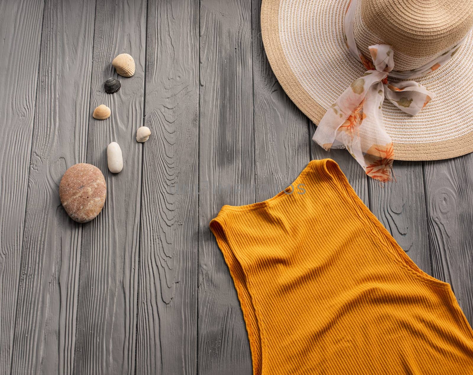 beachwear orange woman top outfit hat bag sun protection sunglasses pebbles. Summer background template mockup free space composition sample text. Top view above wooden background vacation concept