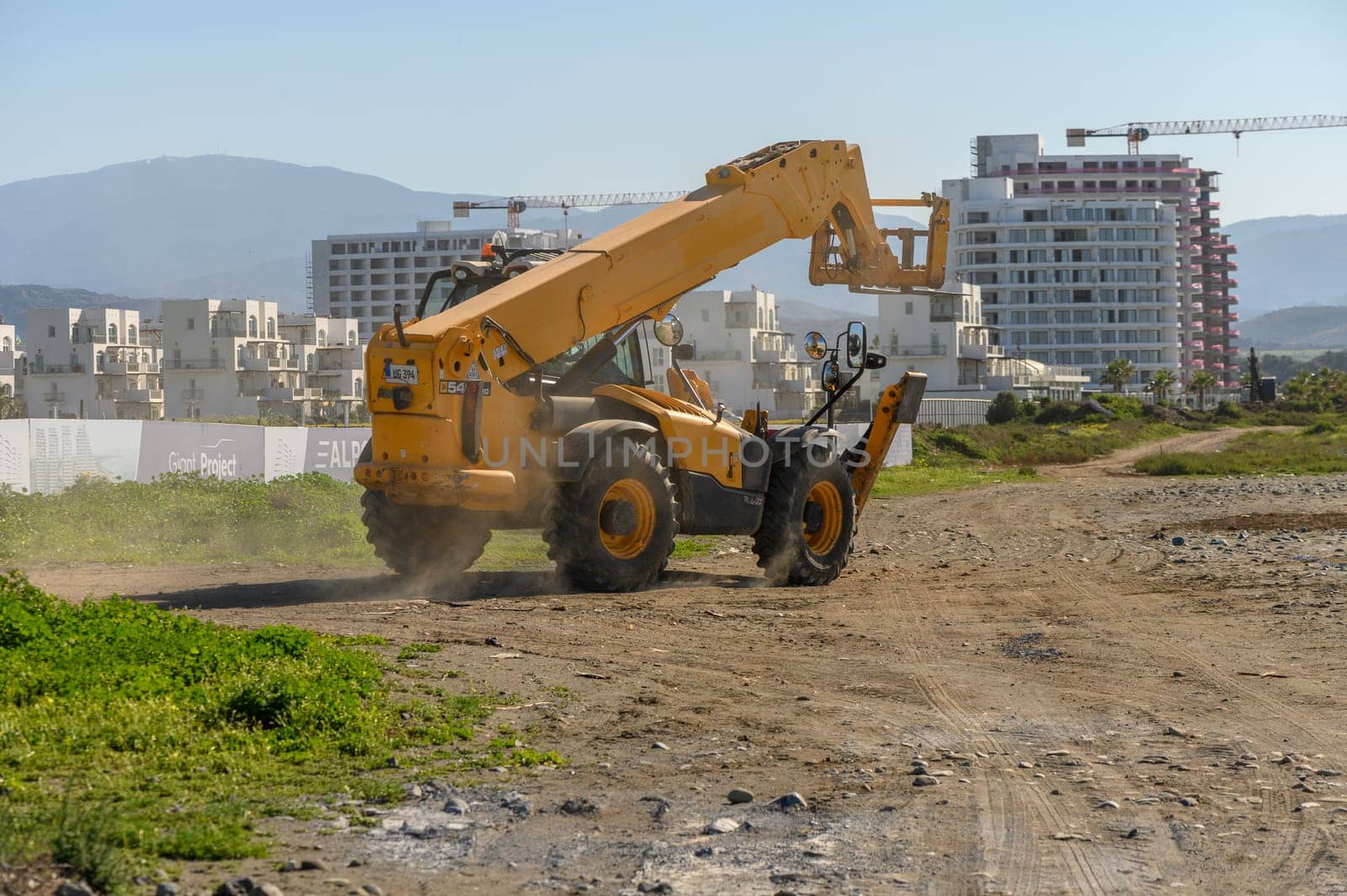 Gaziveren Cyprus 04/03/2024 - front loader rides on a construction site 1