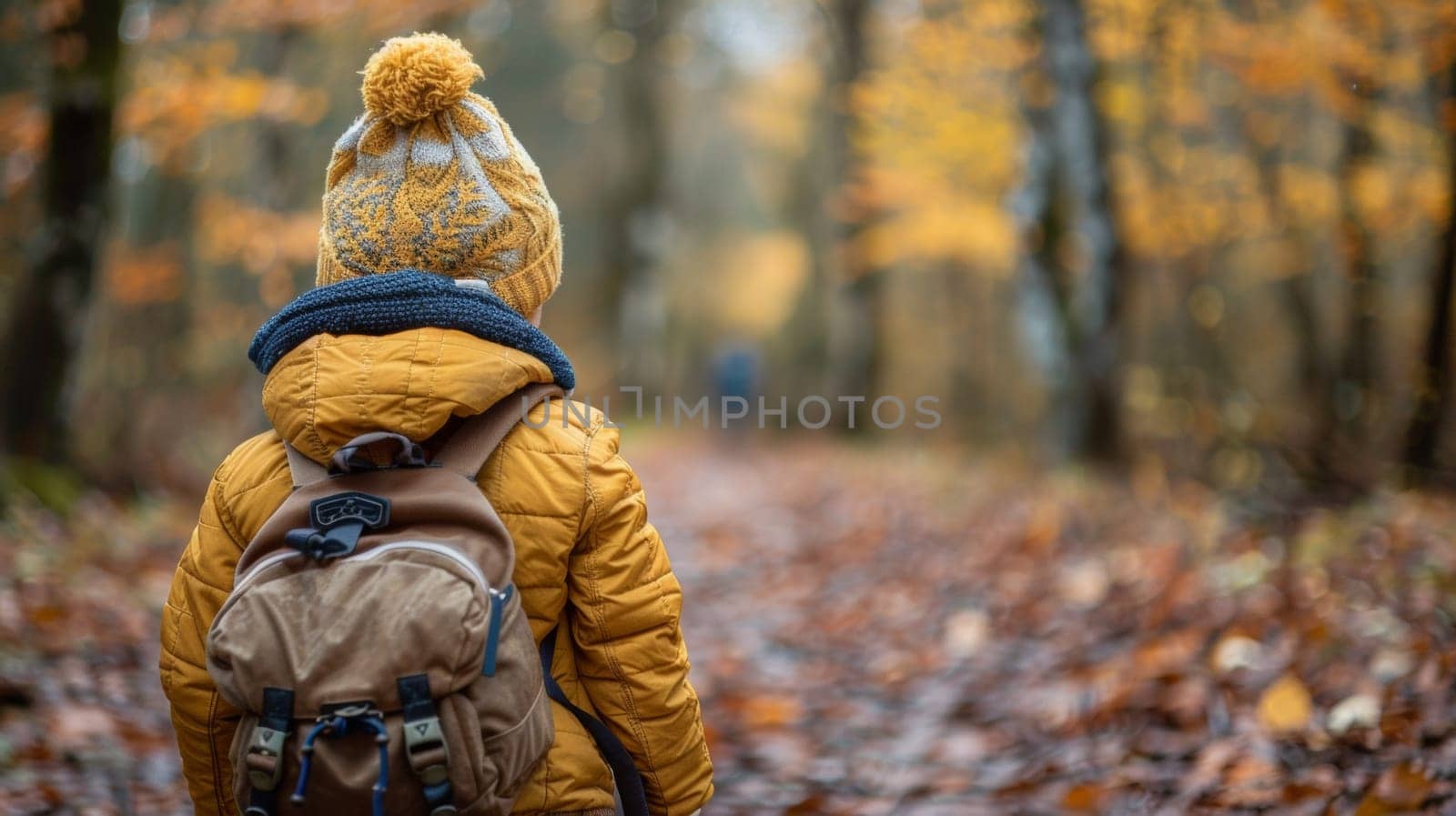 A child with a backpack walking through the woods
