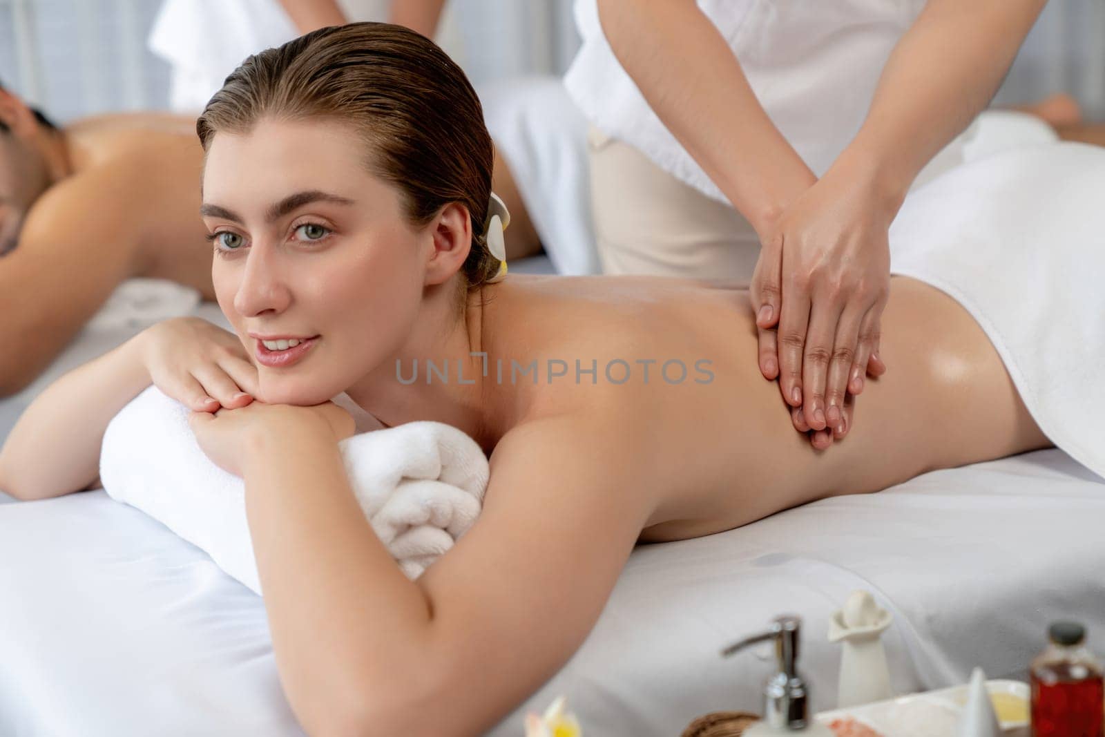 Caucasian couple customer enjoying relaxing anti-stress massage. Quiescent by biancoblue