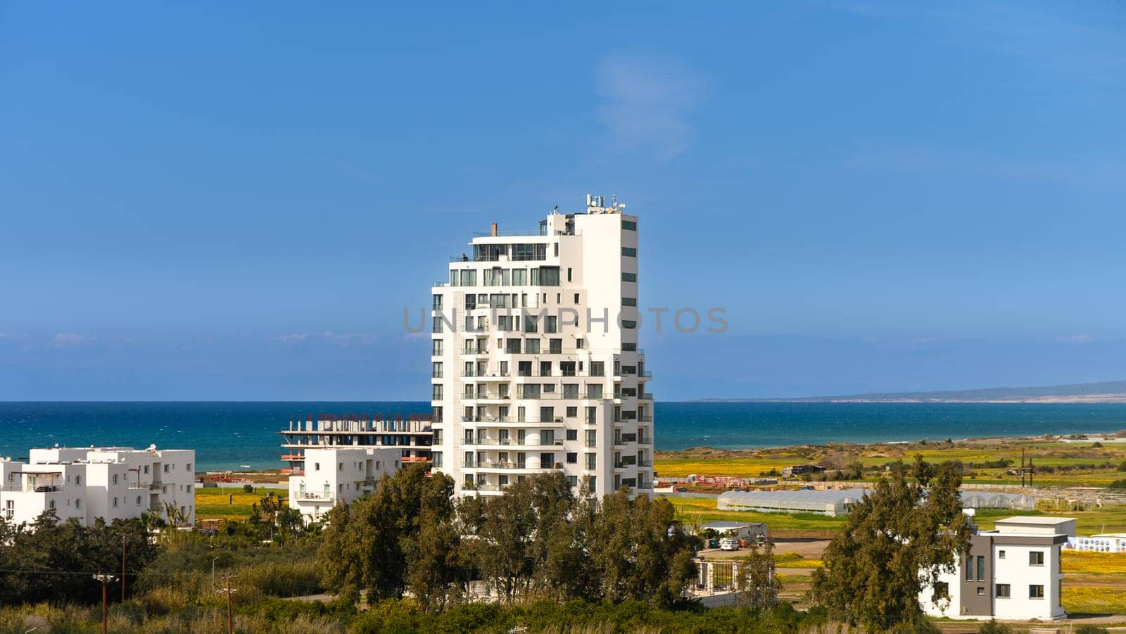 Traditional mediterranean white house with pool on hill with stunning sea view. Summer vacation background.1