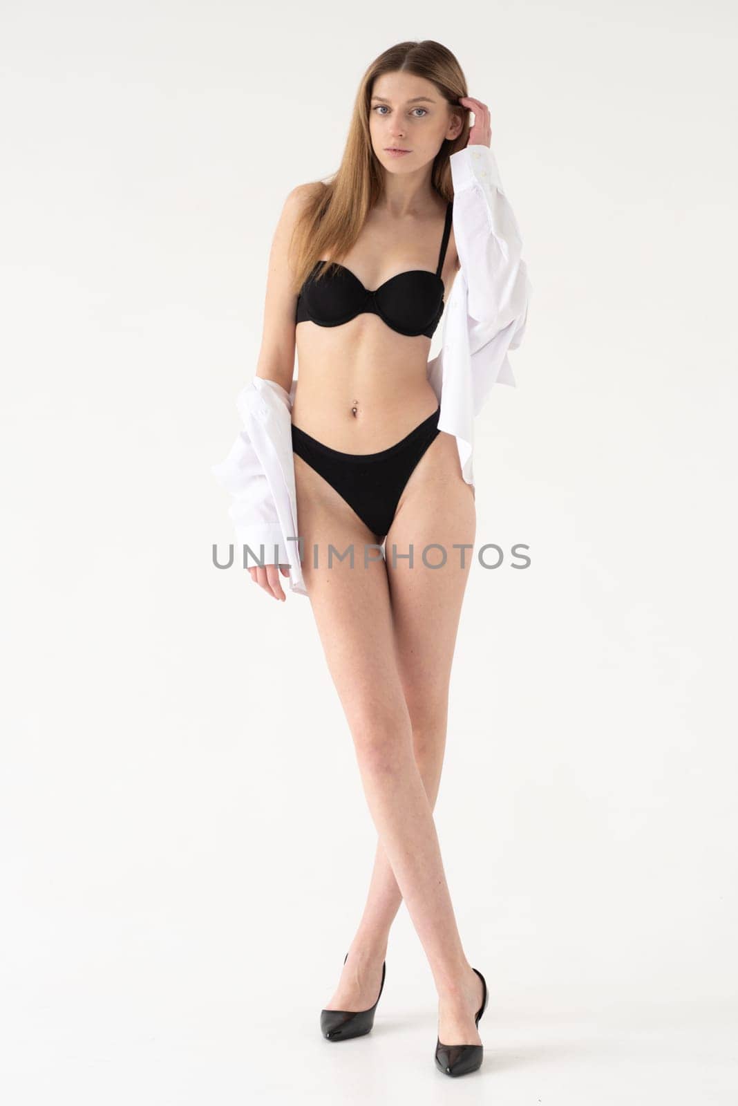 Studio model test, snap, polaroid. Beautiful young european woman on white background by OleksandrLipko