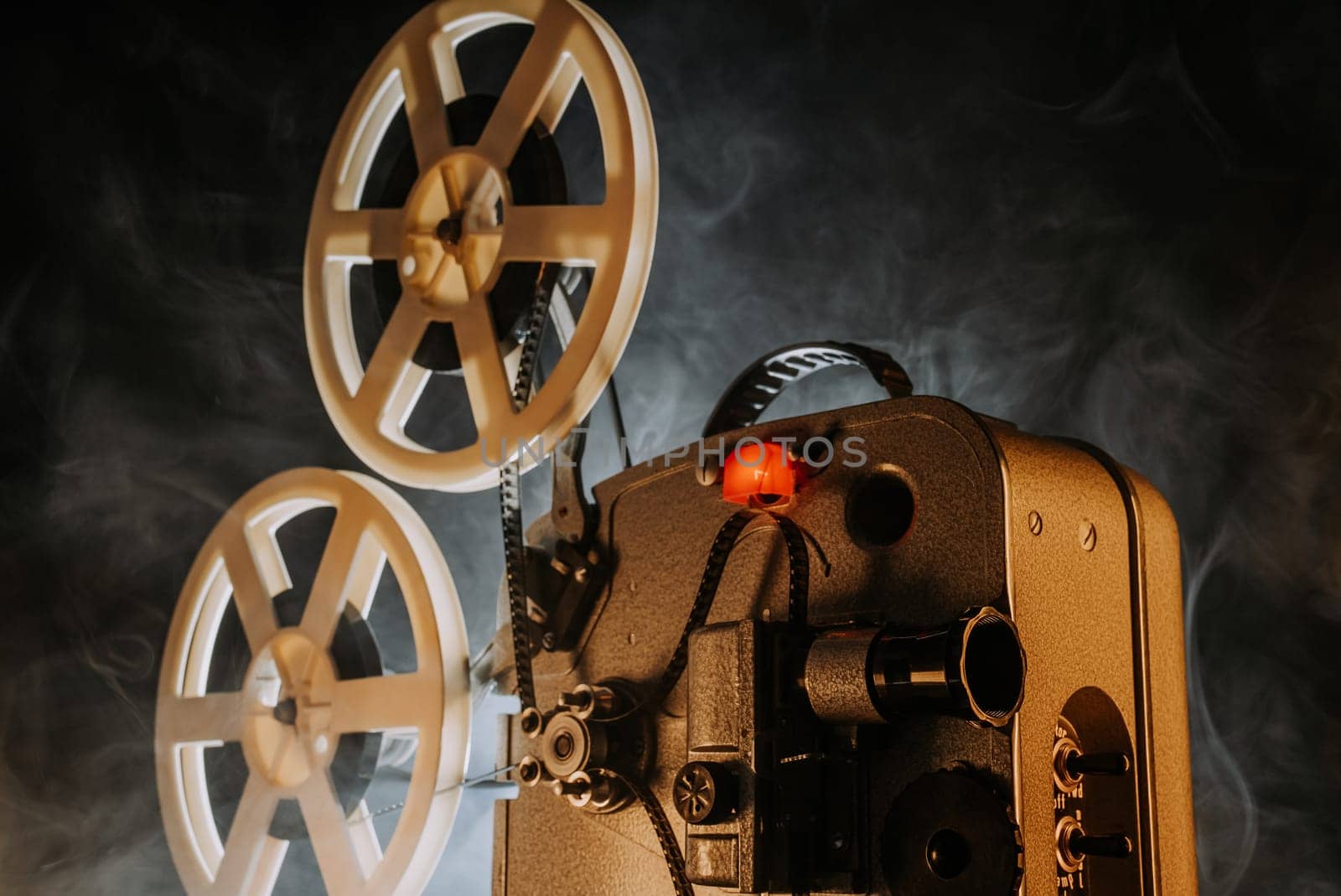 Obsolete film projector, retro home theatre entertainment. Nostalgia, memories by kristina_kokhanova