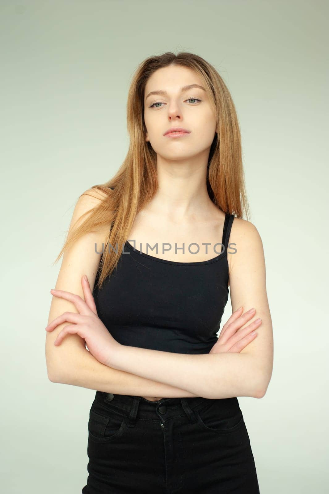 Model test portrait with young beautiful fashion model posing on background.