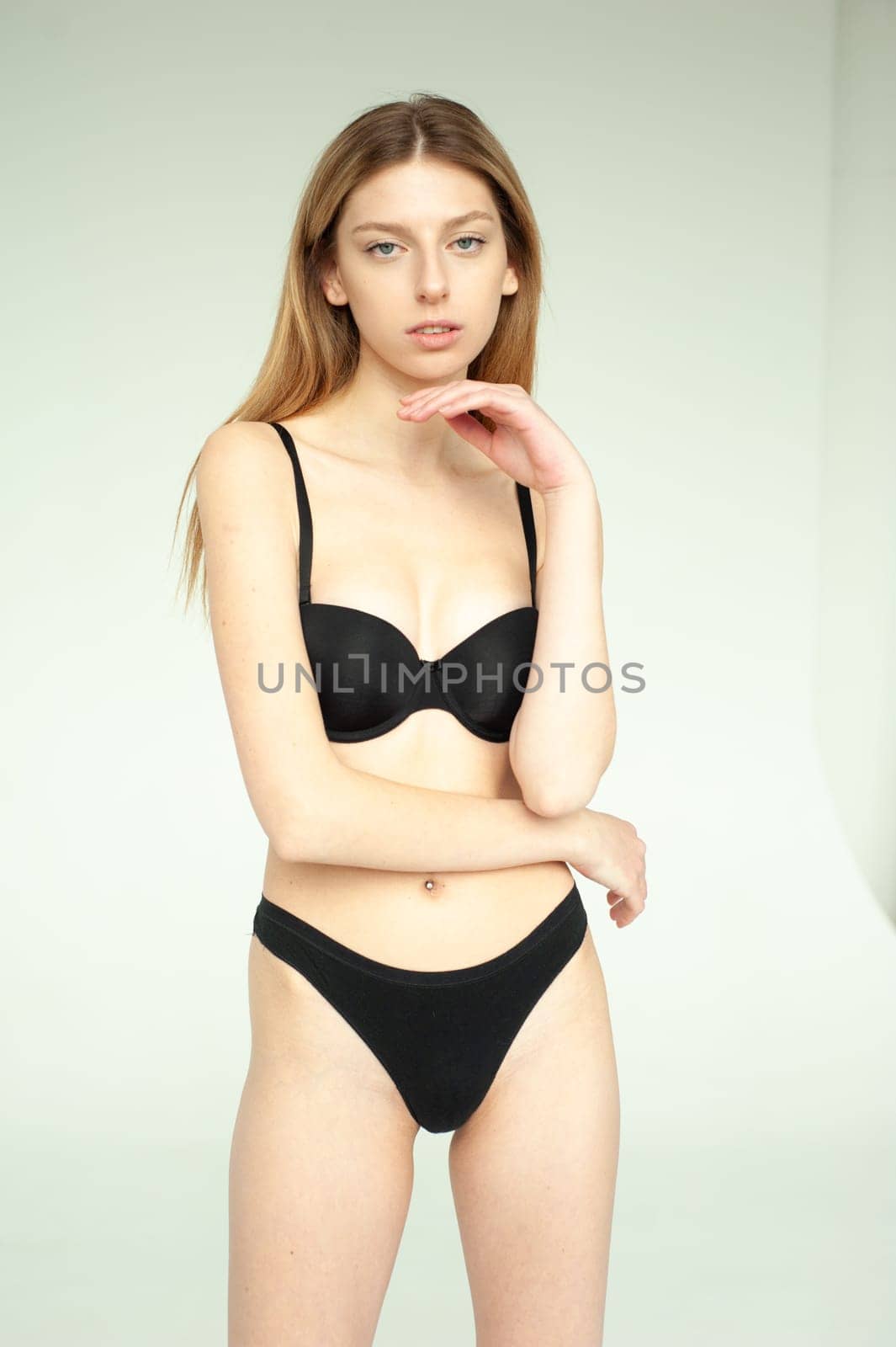 Studio model test, snap, polaroid. Beautiful young european woman on white background by OleksandrLipko