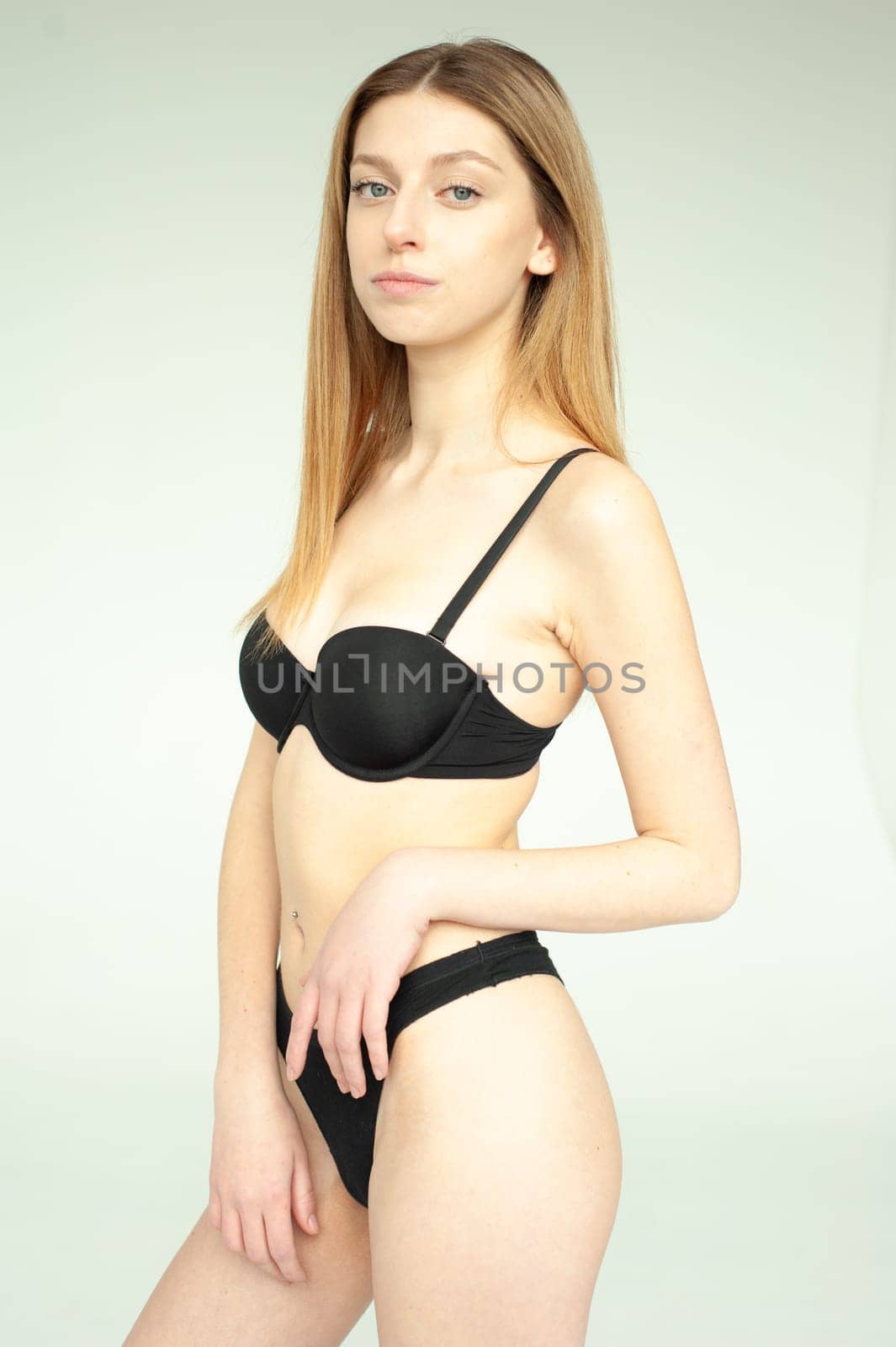 Studio model test, snap, polaroid. Beautiful young european woman on white background by OleksandrLipko