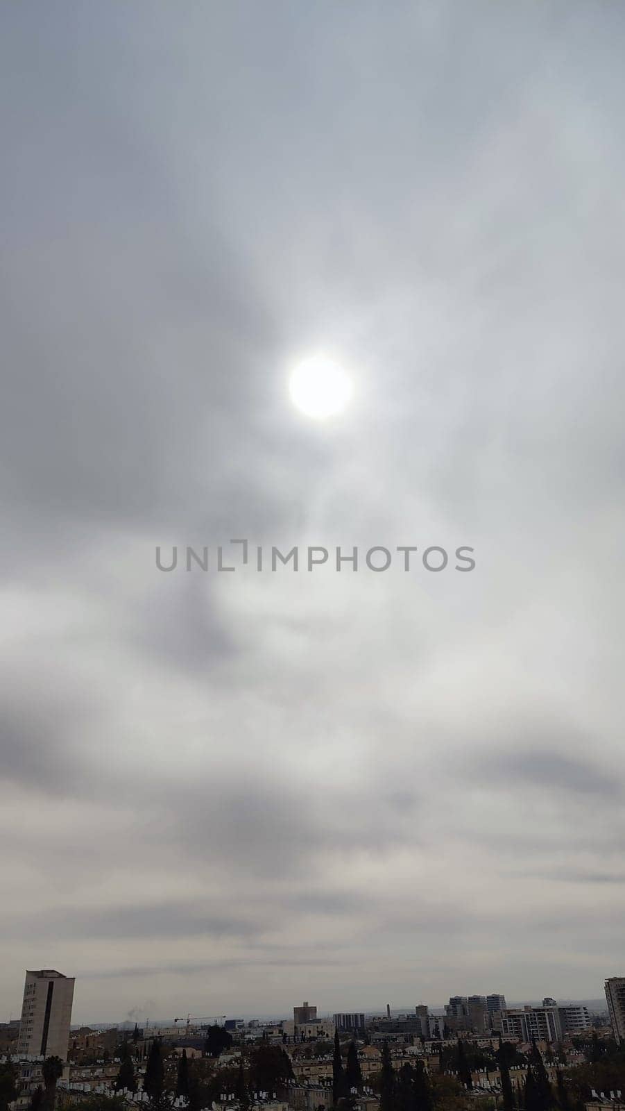 Blue gray light sky nature sun, white clouds whether background, sun face . High quality photo