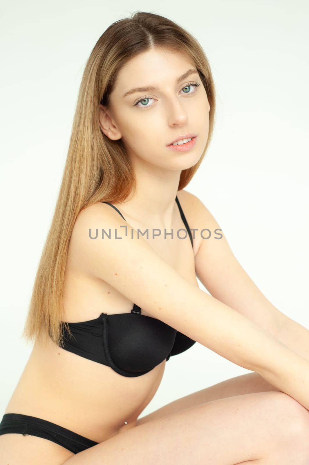 Studio model test, snap, polaroid. Beautiful young european woman on white background by OleksandrLipko