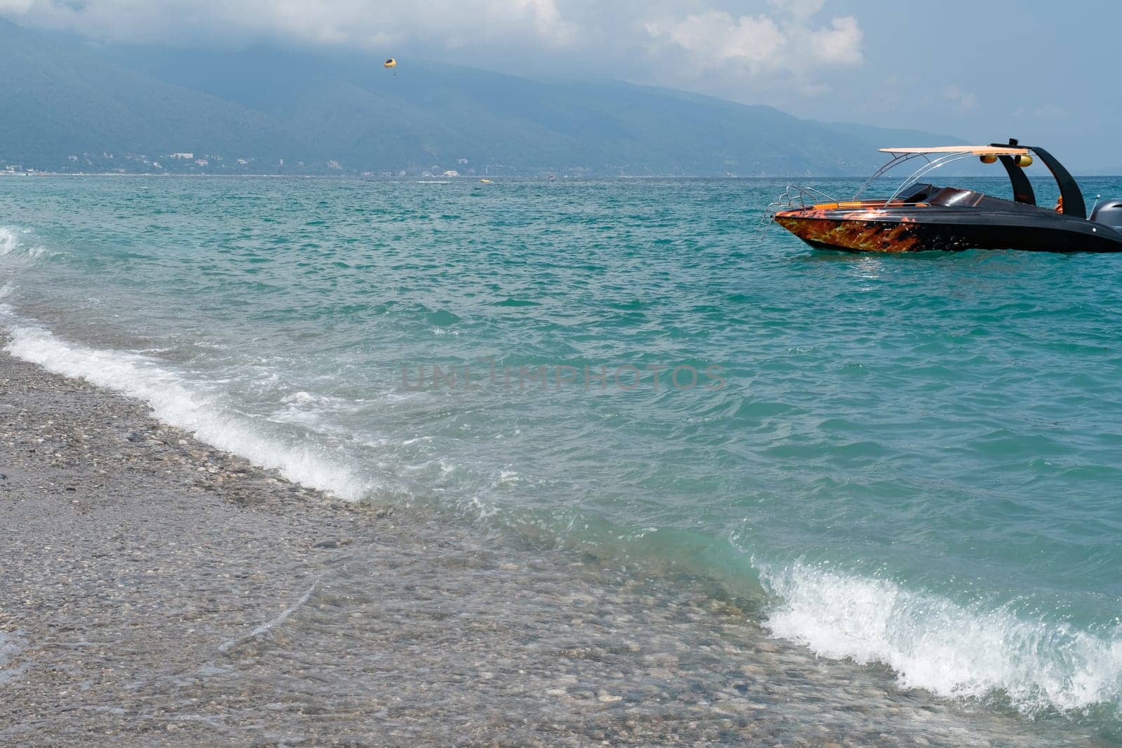 View of a tourist boat on the Black Sea coast in Abkhazia.