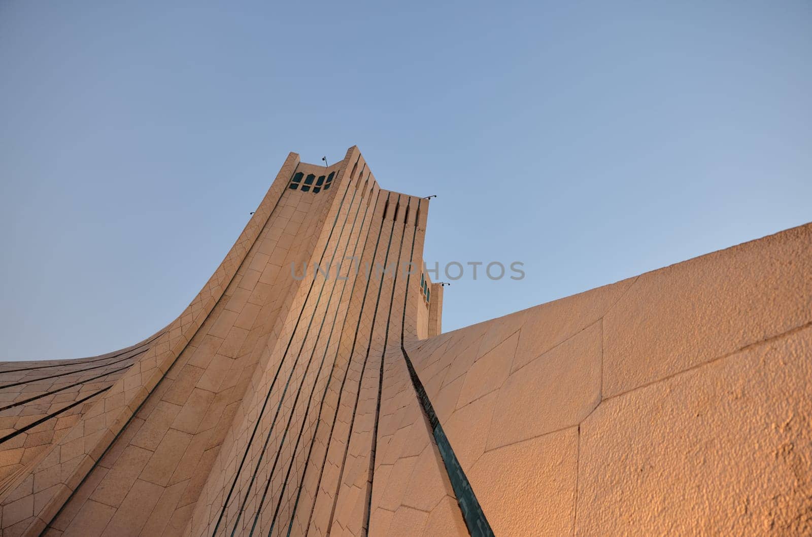 The Azadi Tower is a symbol of freedom in Iran, the main symbol of Iran's capital. MS ZI LA Azadi Tower - Freedom Tower, the gateway to Tehran, Popular tourist point at twilight. 02.12.22 Tehran, Iran by EvgeniyQW