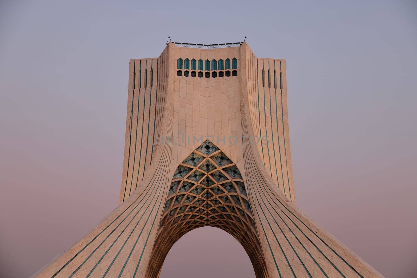 The Azadi Tower is a symbol of freedom in Iran, the main symbol of Iran's capital. MS ZI LA Azadi Tower - Freedom Tower, the gateway to Tehran, Popular tourist point at twilight. 02.12.22 Tehran, Iran by EvgeniyQW