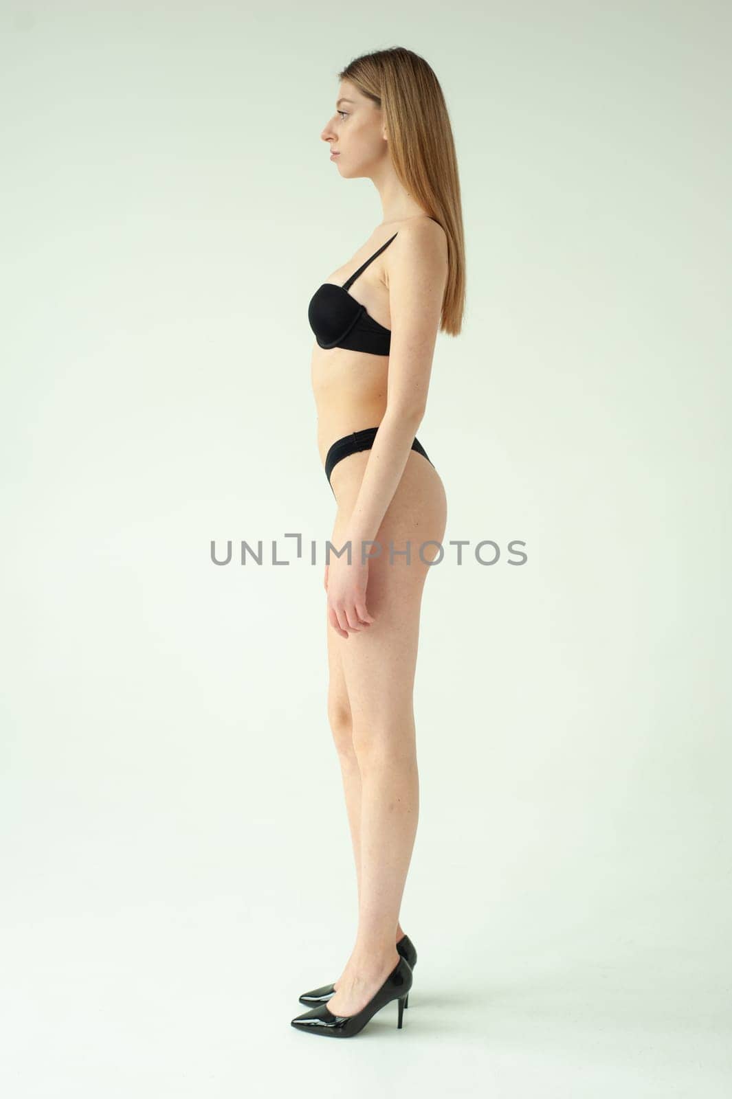 Studio model test, snap, polaroid. Beautiful young european woman on white background by OleksandrLipko