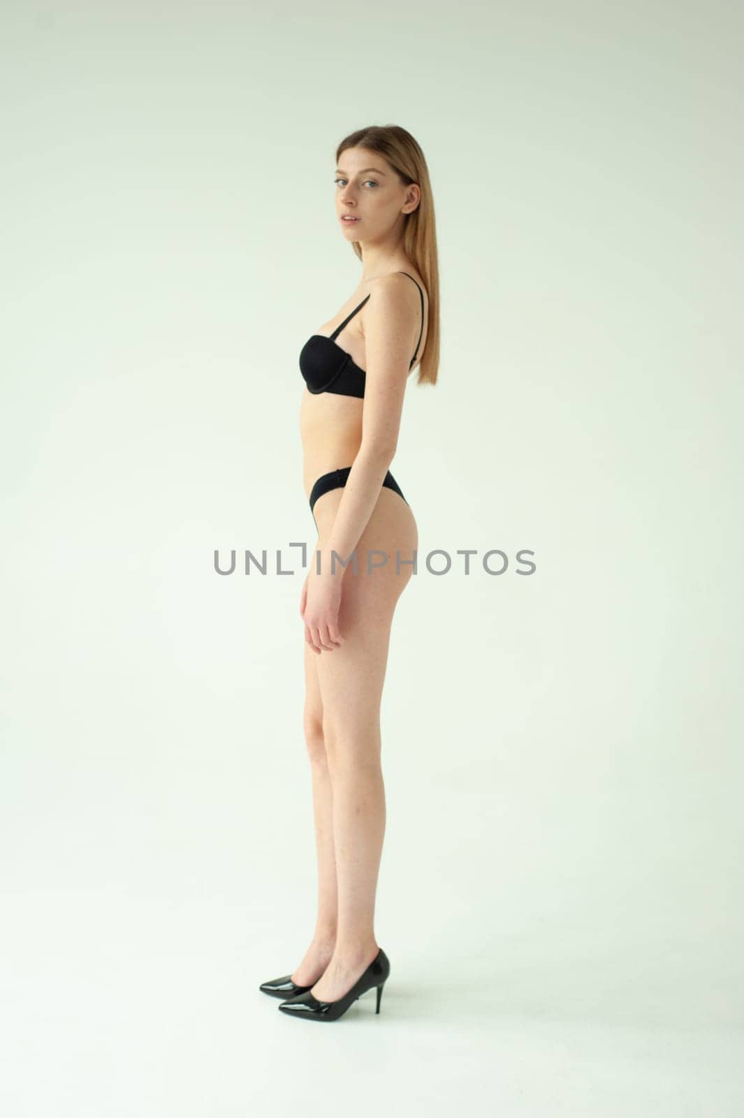 Studio model test, snap, polaroid. Beautiful young european woman on white background by OleksandrLipko