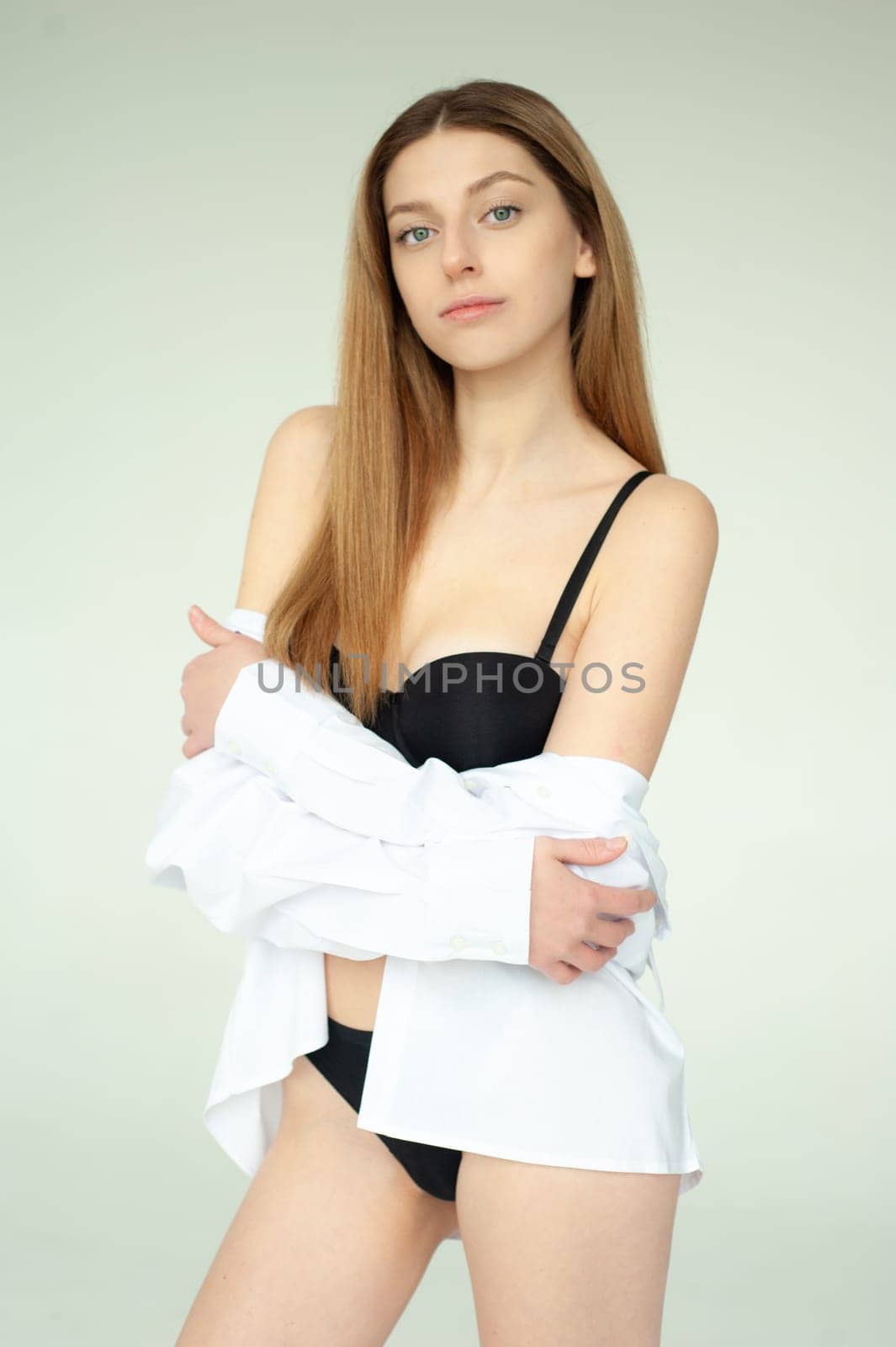 Studio model test, snap, polaroid. Beautiful young european woman on white background by OleksandrLipko