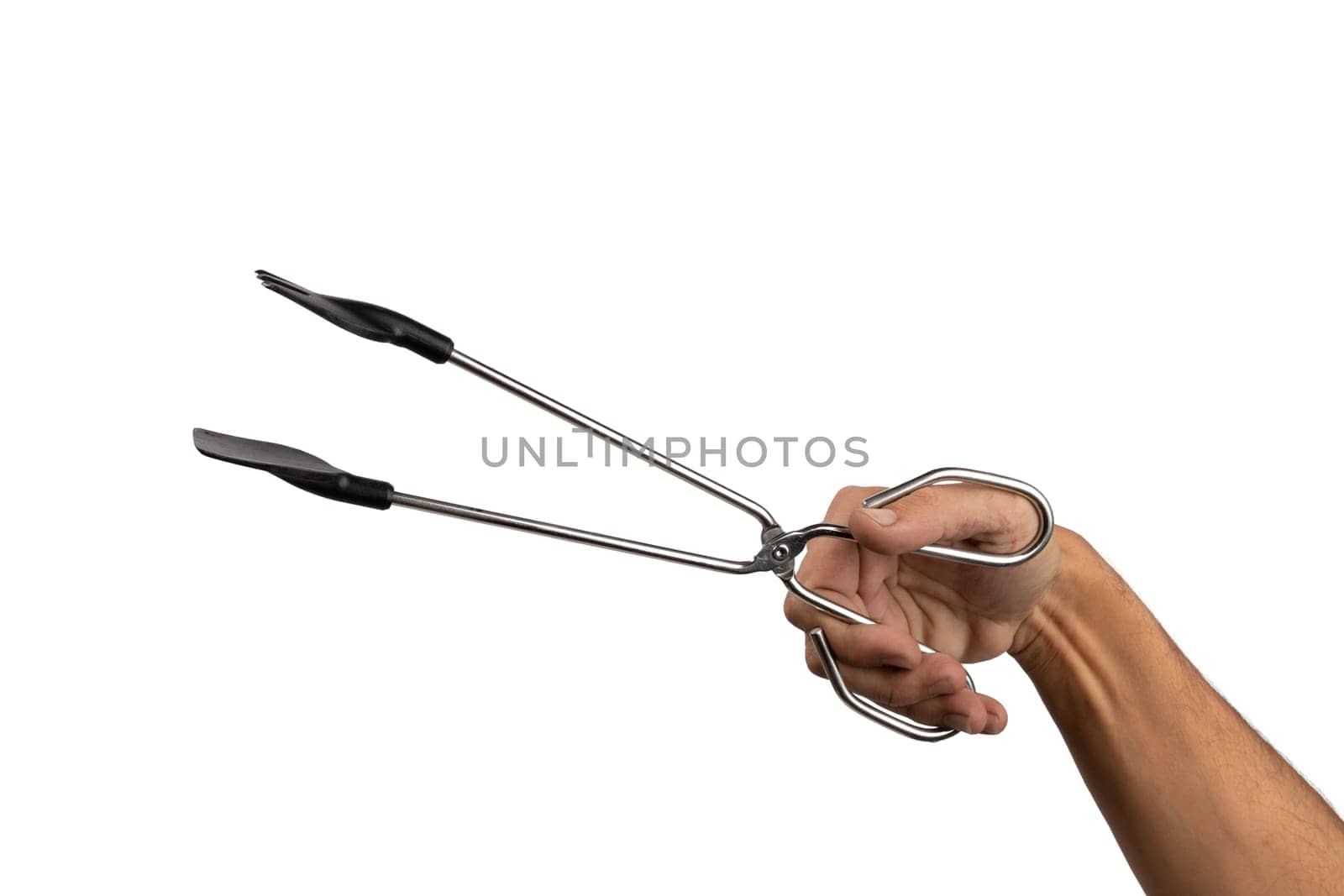 Male hand holding kitchen tong isolated white background by TropicalNinjaStudio