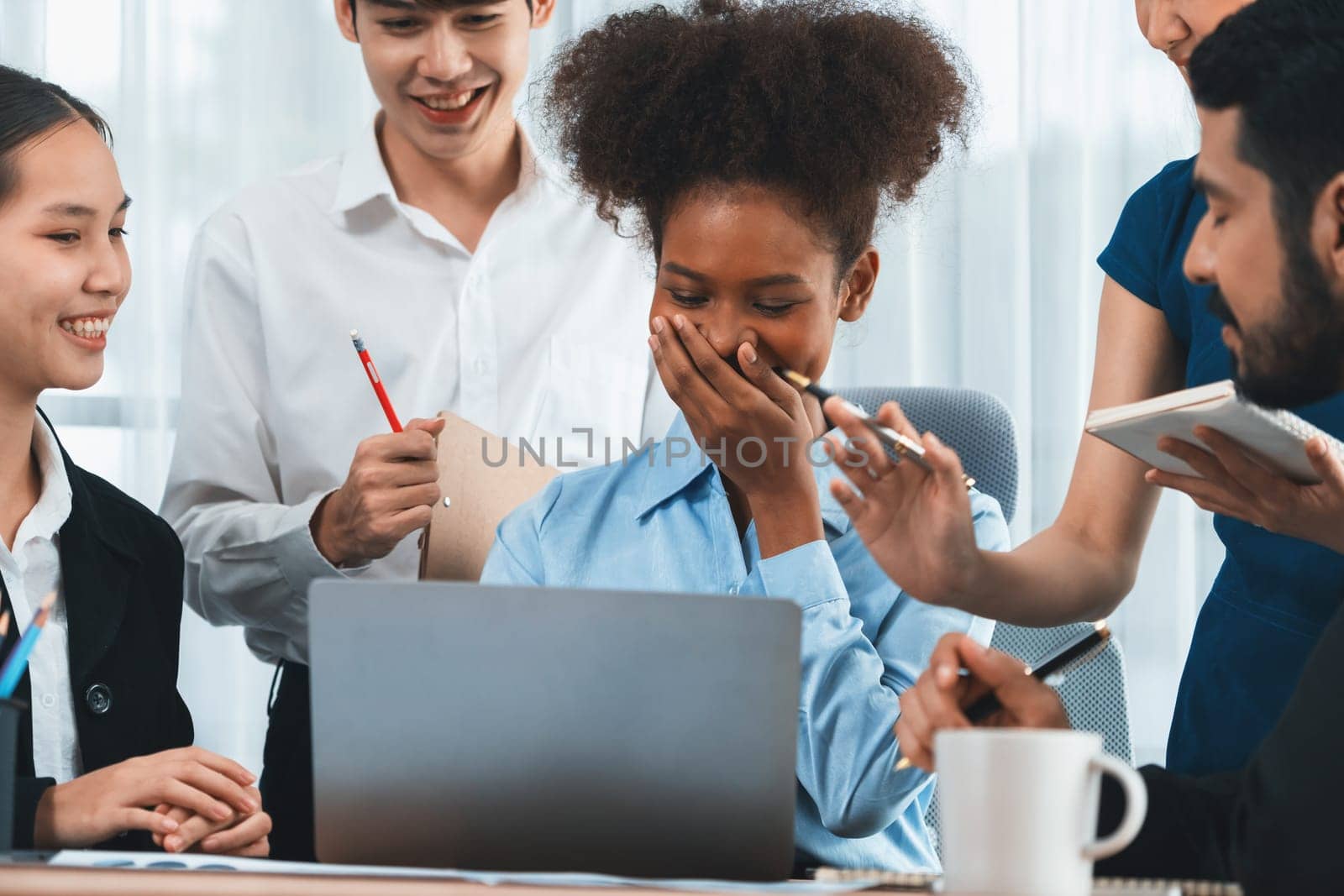 Happy diverse business people work together, discussing in corporate office. Professional and diversity teamwork discuss business plan on desk with laptop. Modern multicultural office worker. Concord